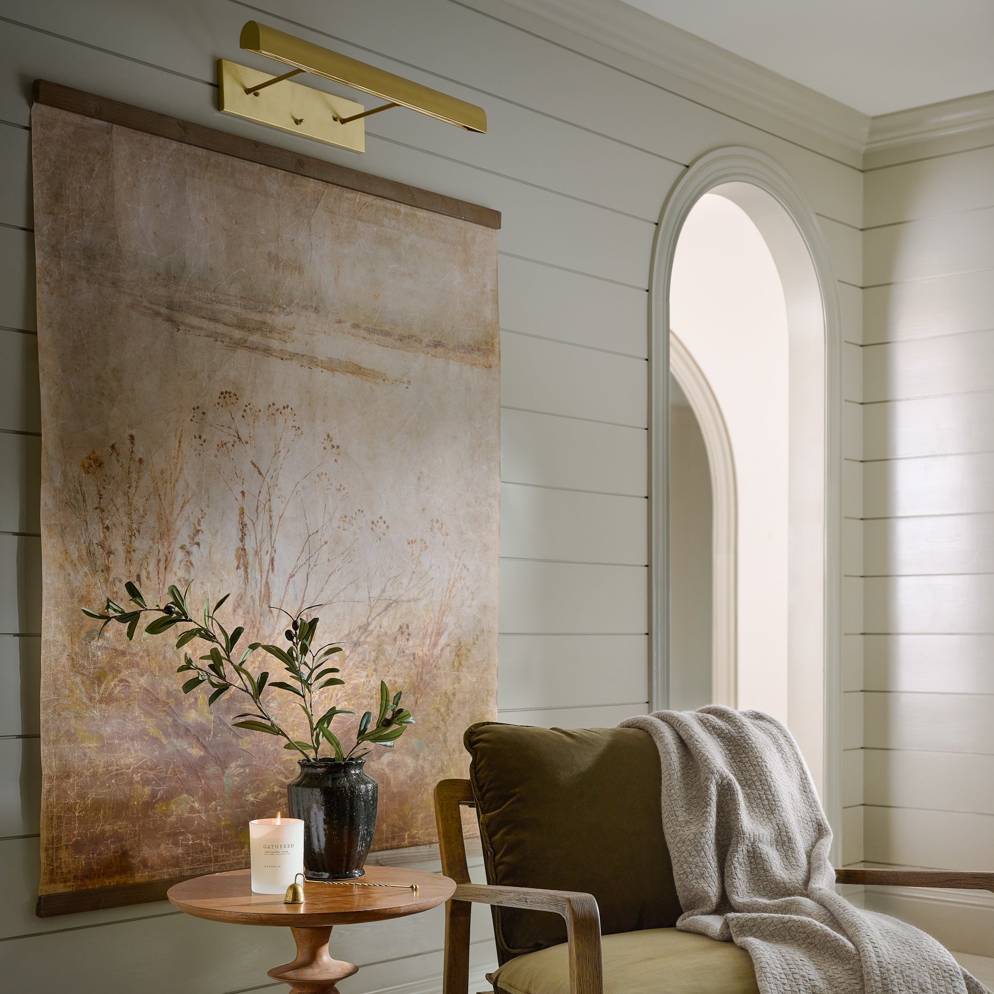 Oversized Fog On The Shore Vintage Tapestry hung above chair and table