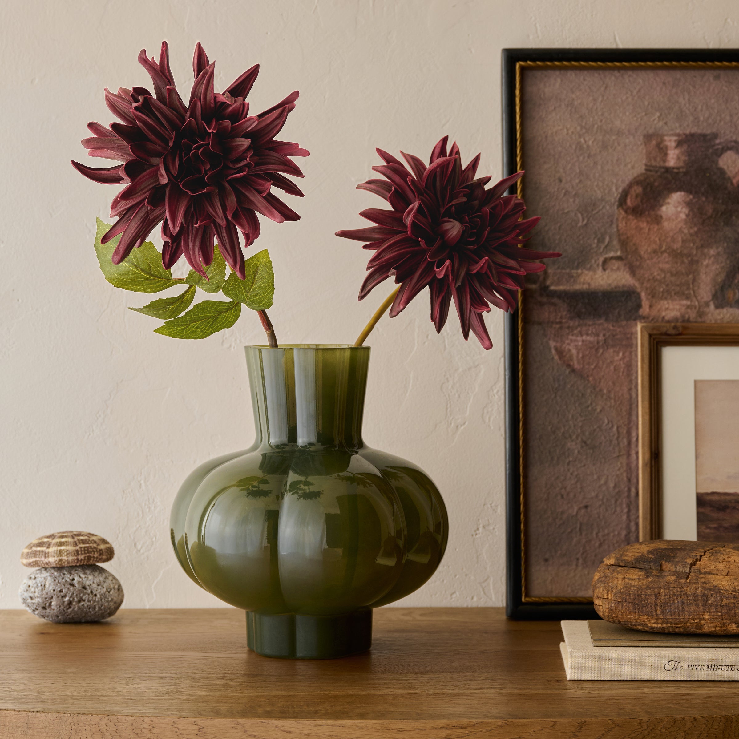 burgundy Autumnal Dahlia shown in green glass vase