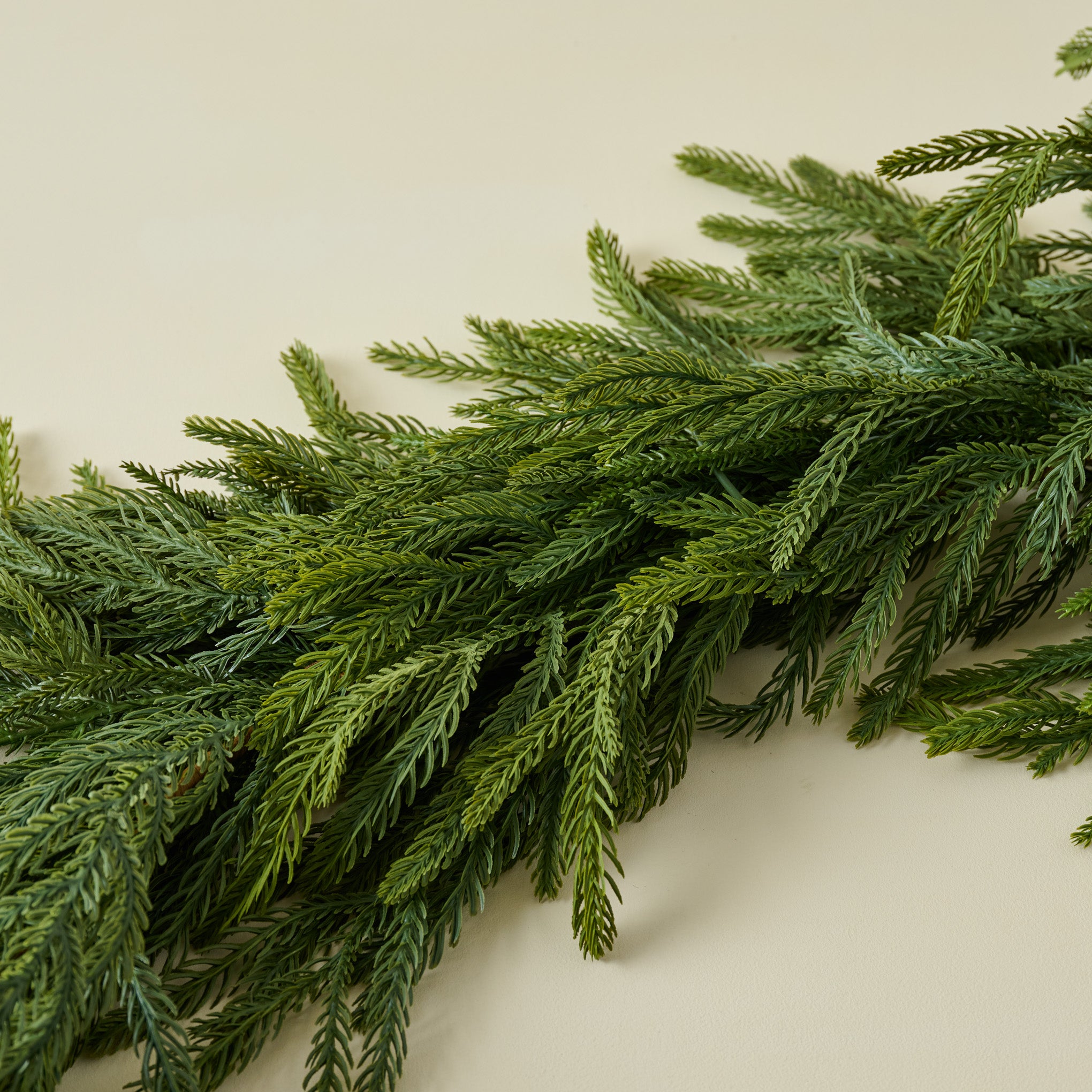 close up of Real Touch Oversized Norfolk Pine Garland showing lifelike look 