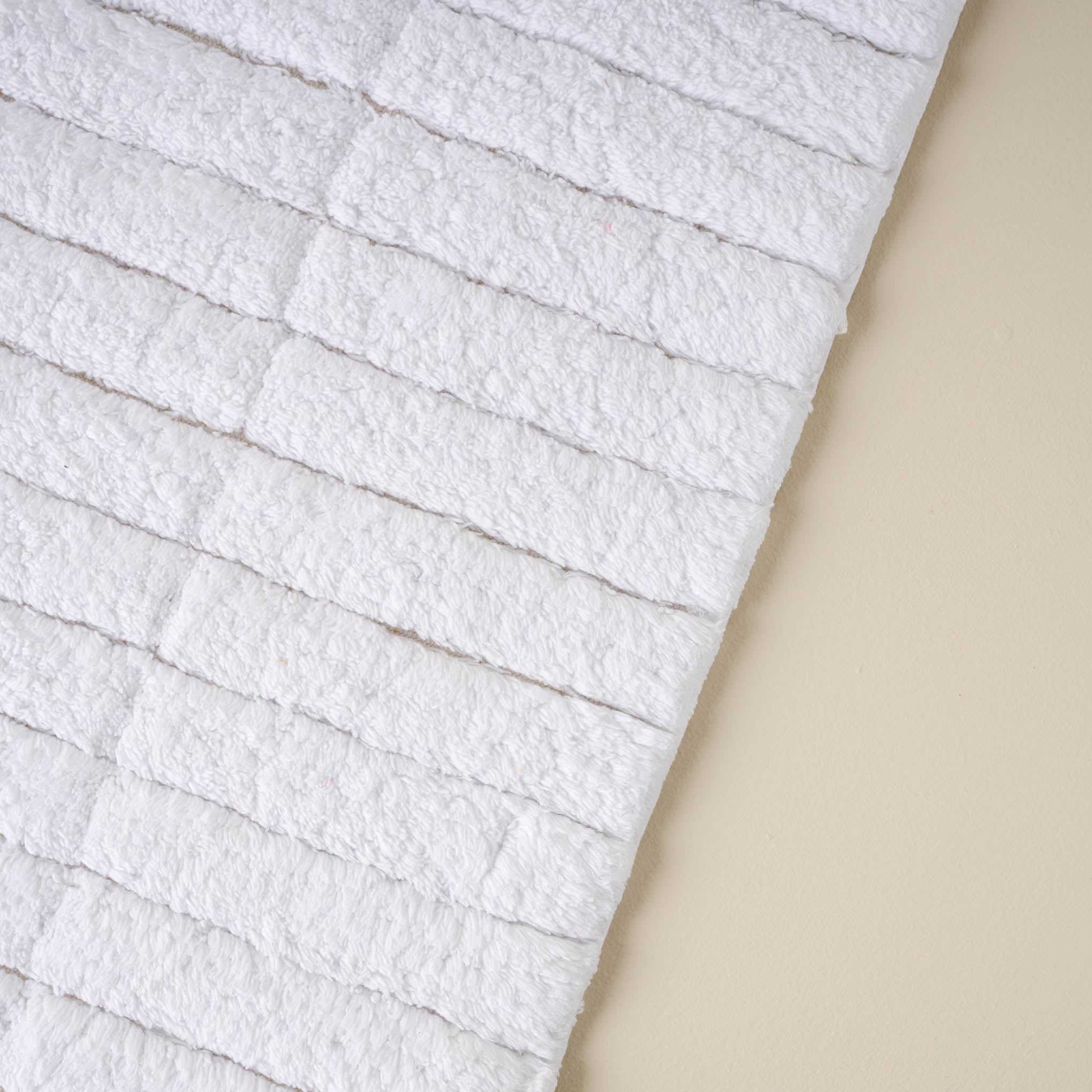 close up view of White Textured Bath Mat