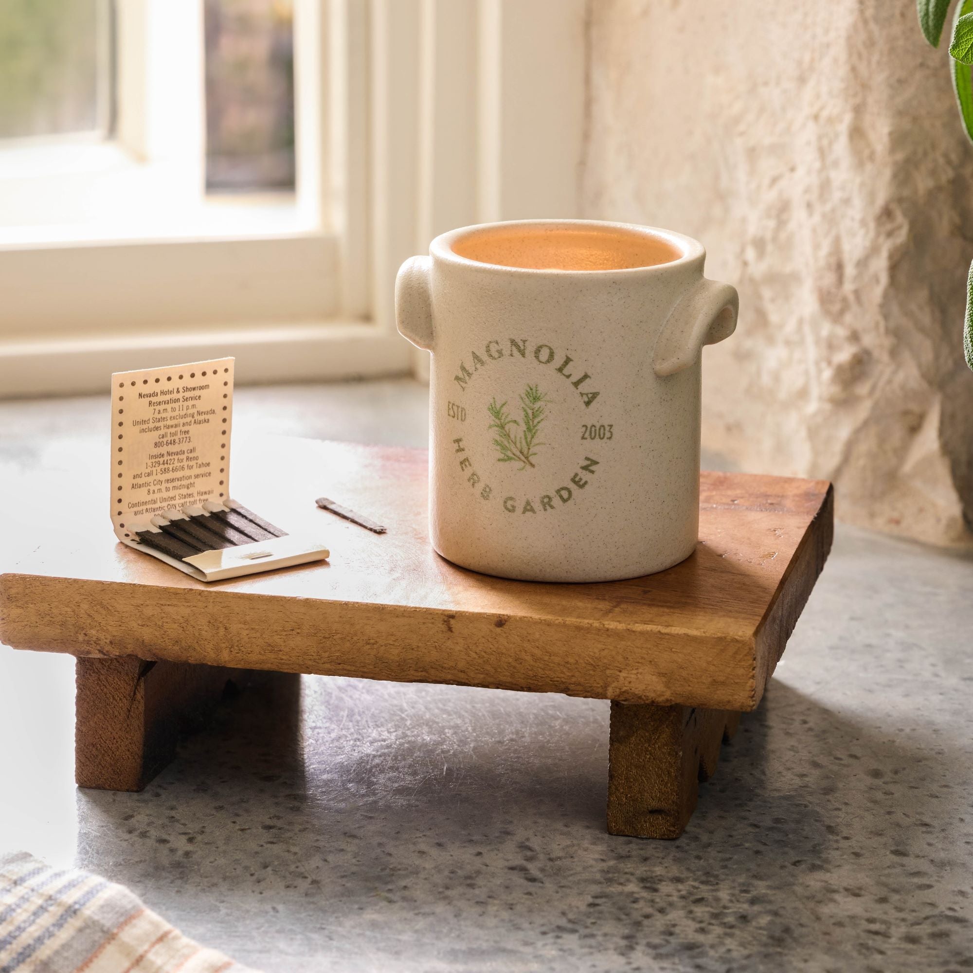 Magnoliass Herb Garden Candle set on wooden riser