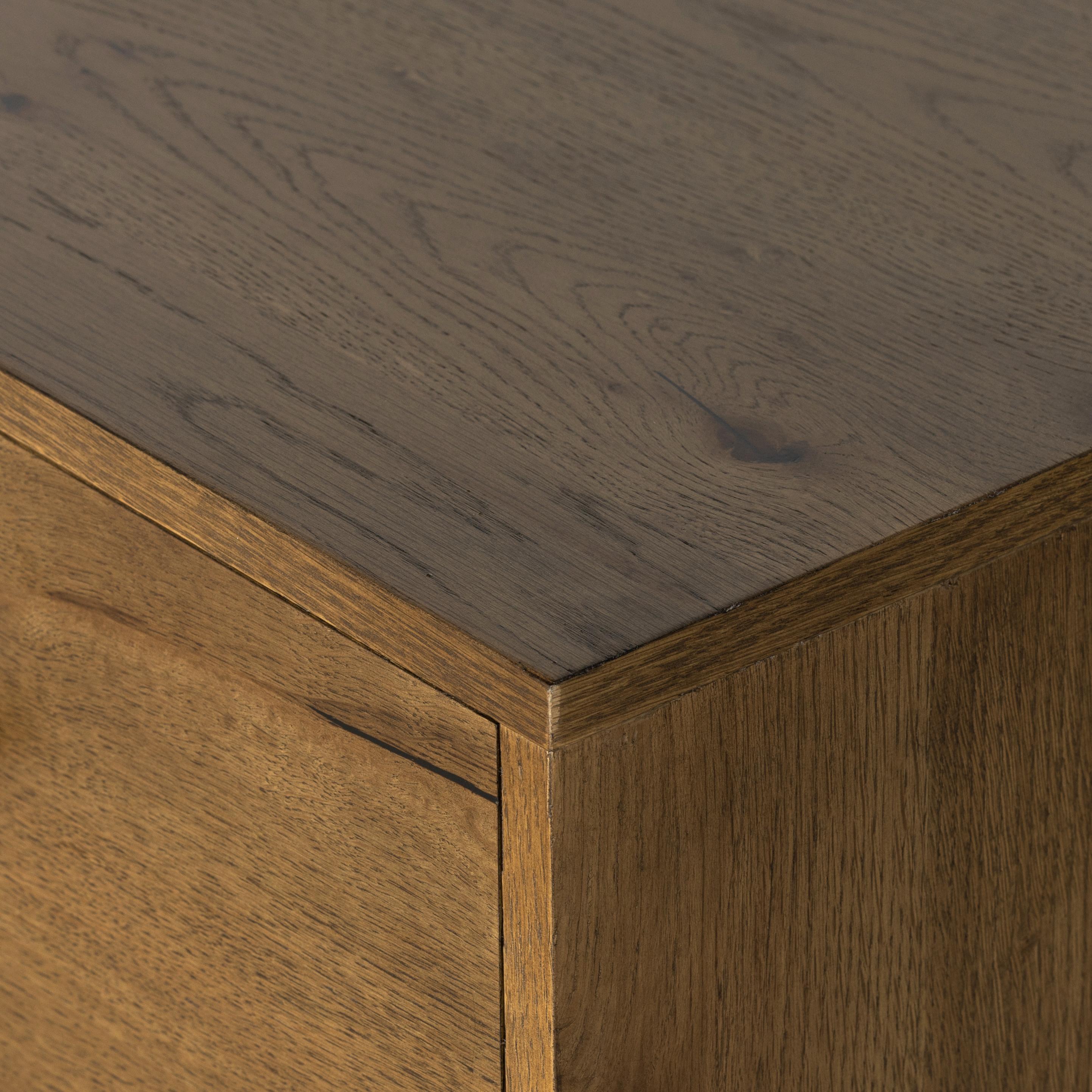 Liam 9 Drawer Dresser in amber oak close up of top corner