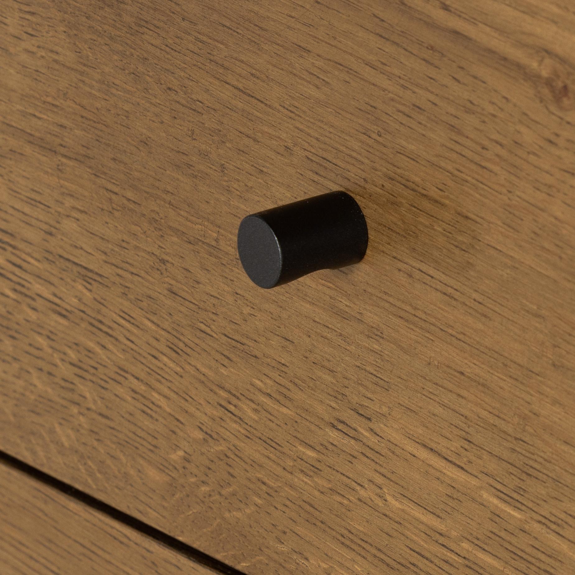 Liam 9 Drawer Dresser in amber oak close up of pull knob