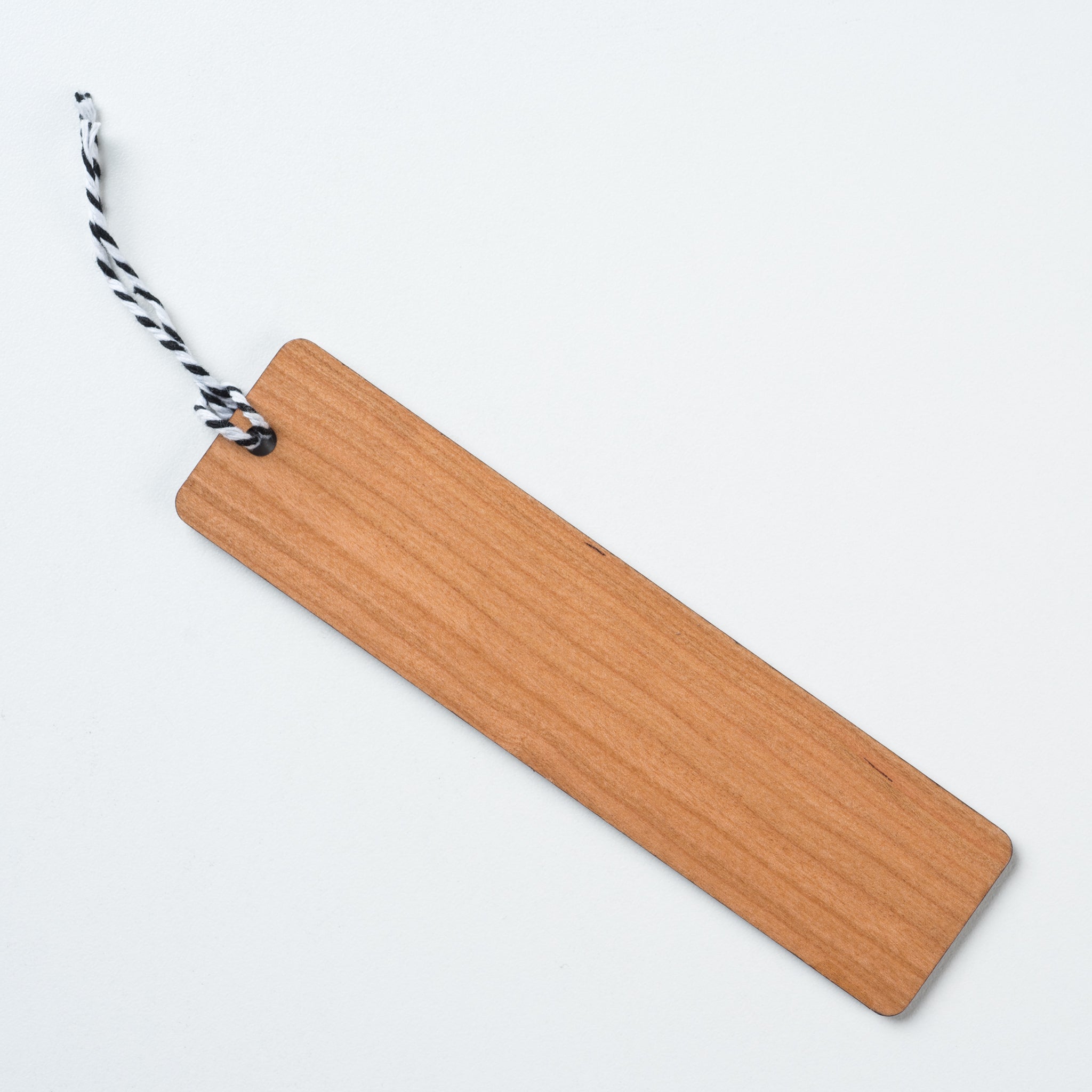 wooden bookmark with Magnoliass logo