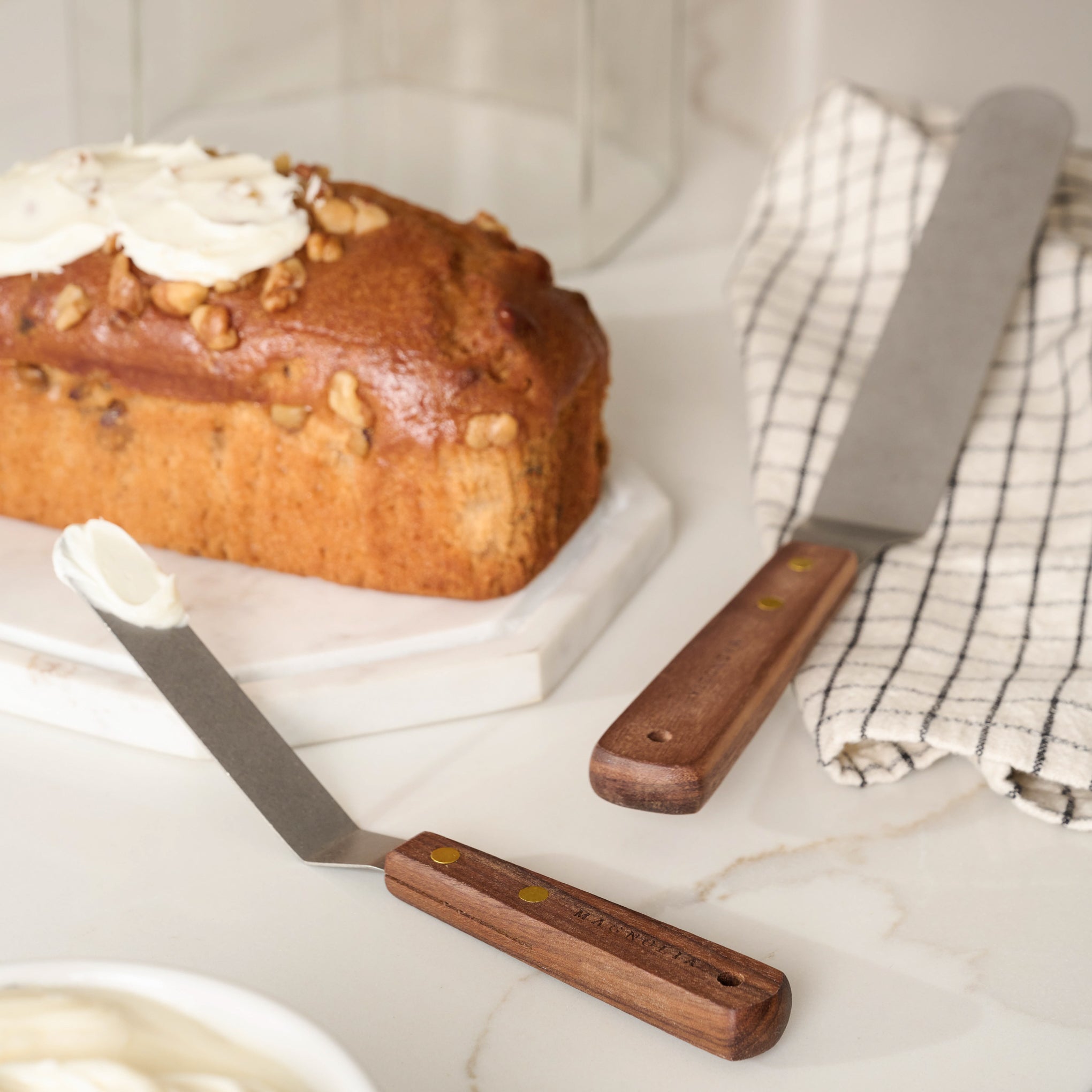 Gristmill Collection Walnut Icing Spatula with Vintage Finish on counter