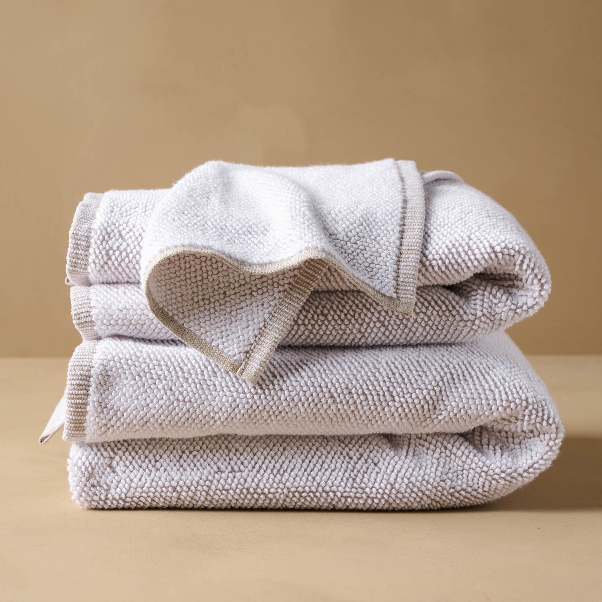 Linen Assisi Textured Towel folded with wash cloth draped on top