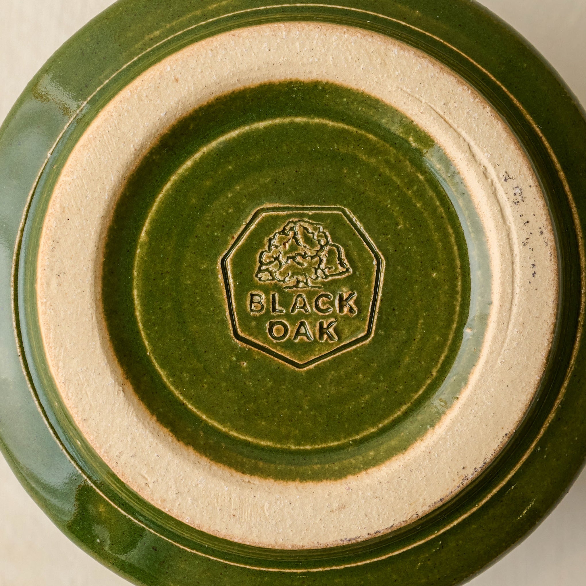 Magnoliass Established Mug - Green close up of bottom of mug with black oak logo
