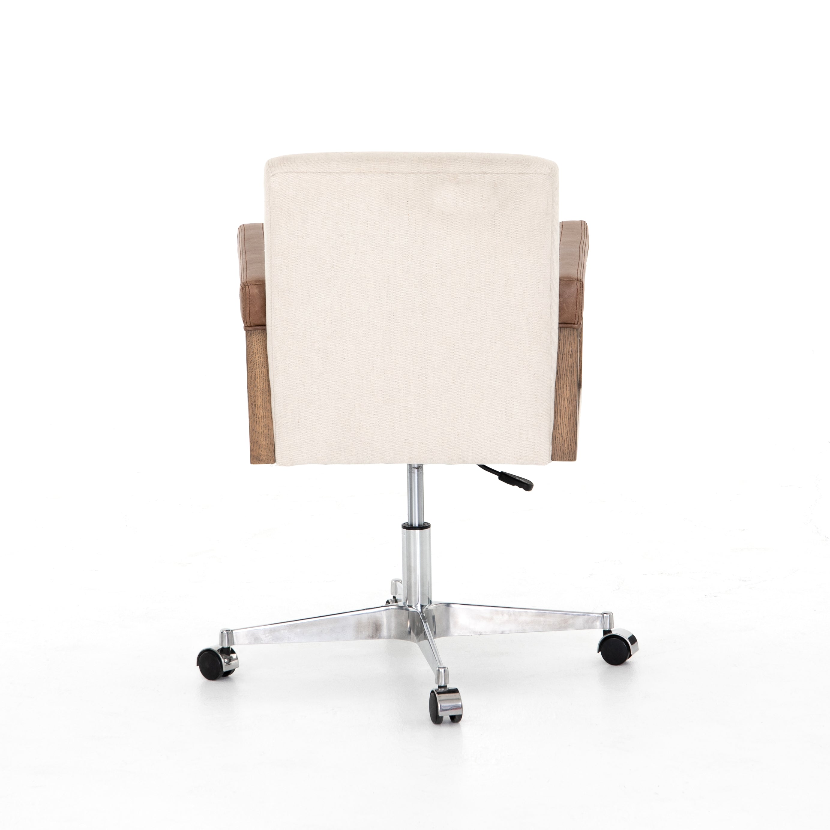 cream linen desk chair with leather-wrapped wooden arms and chrome metal base with wheels