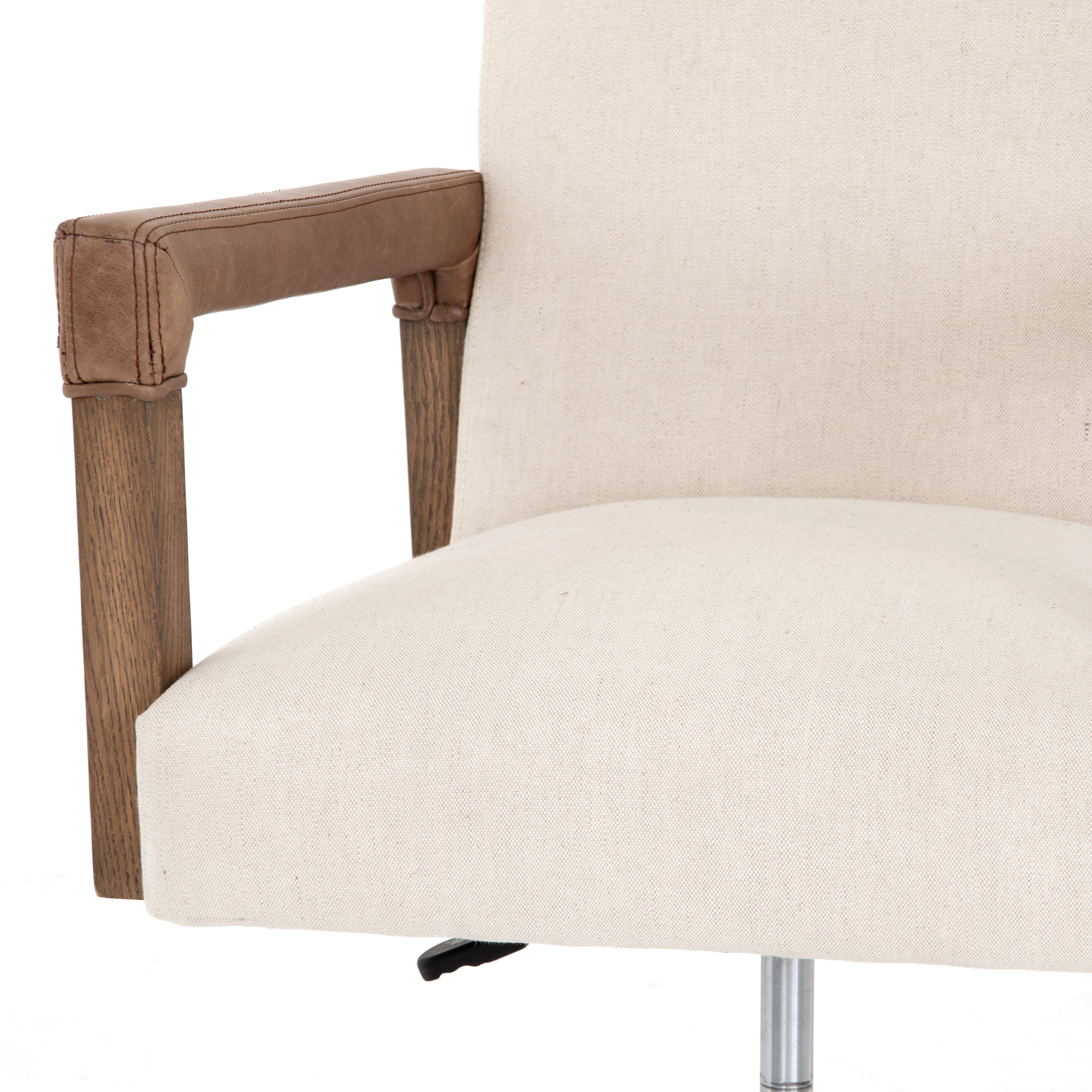 cream linen desk chair with leather-wrapped wooden arms and chrome metal base with wheels