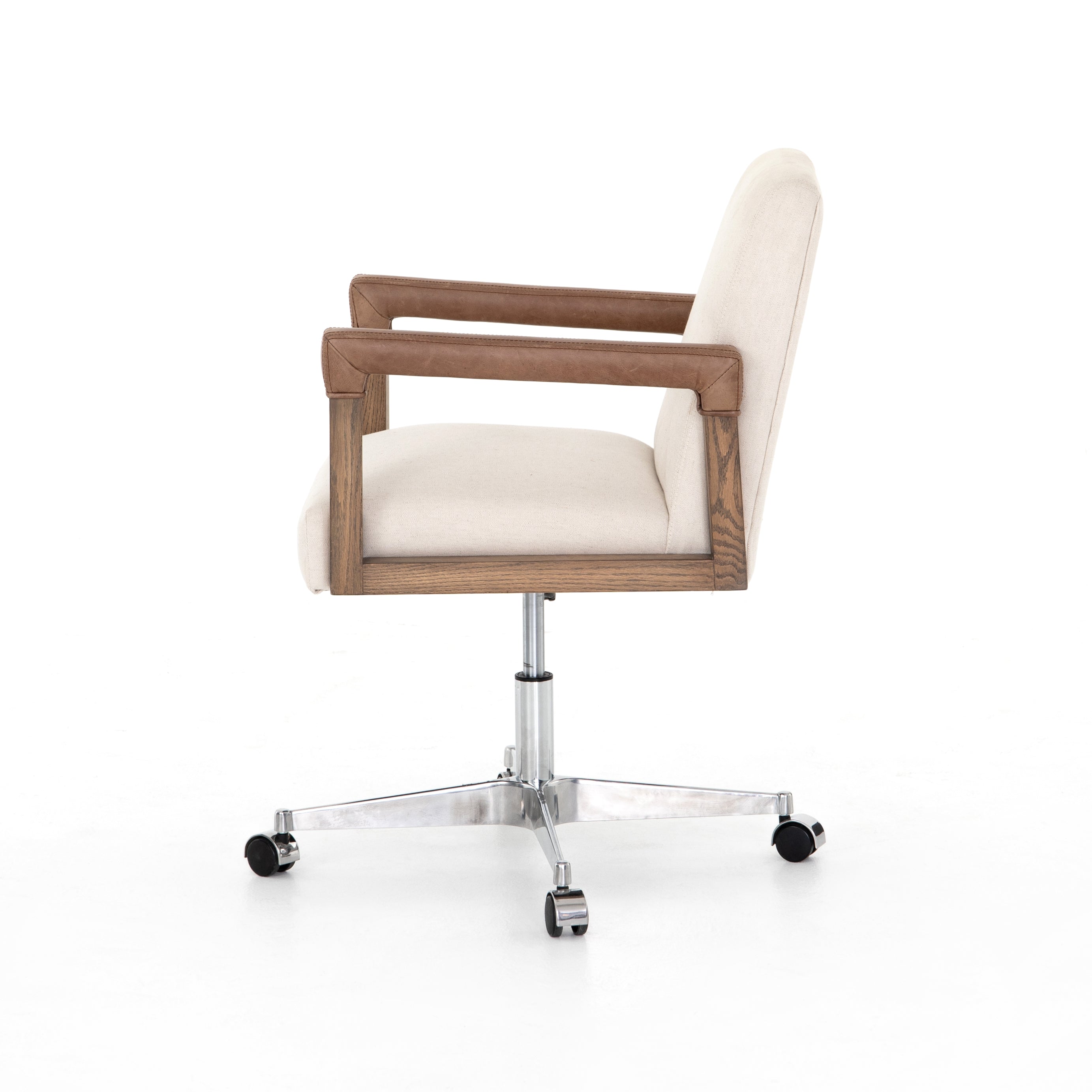 cream linen desk chair with leather-wrapped wooden arms and chrome metal base with wheels