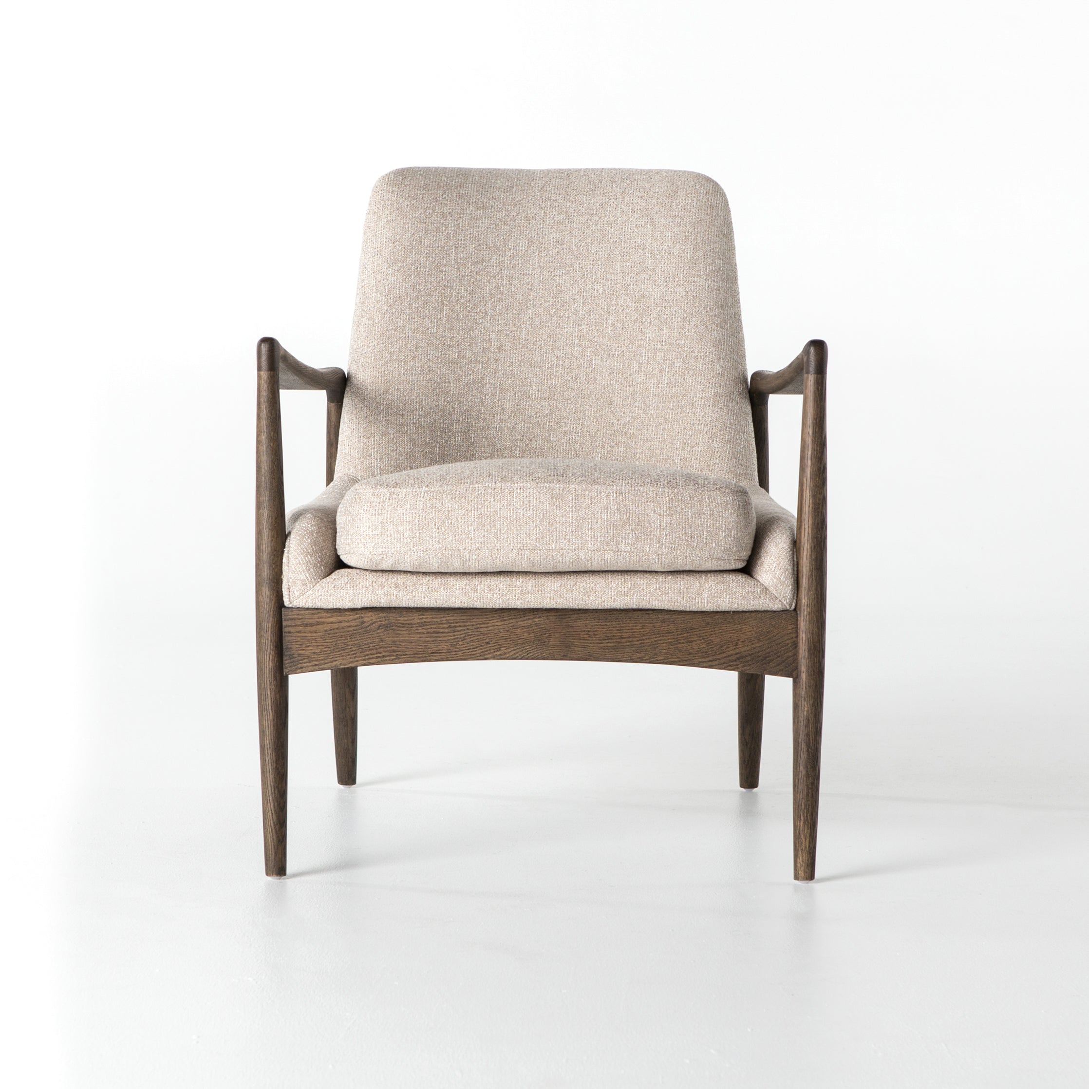 cream fabric mid century modern arm chair with wooden arms and legs