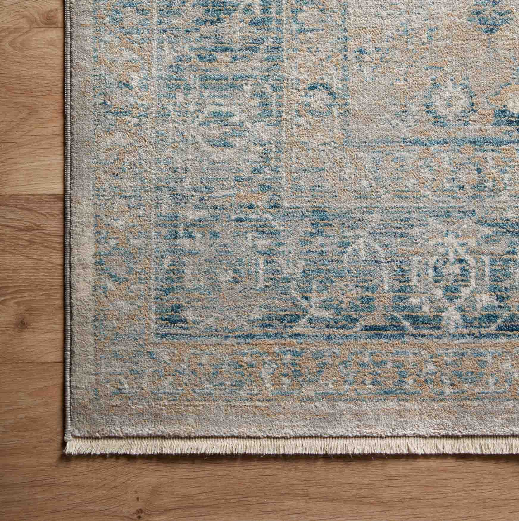 beige and blue traditional area rug with floral detail