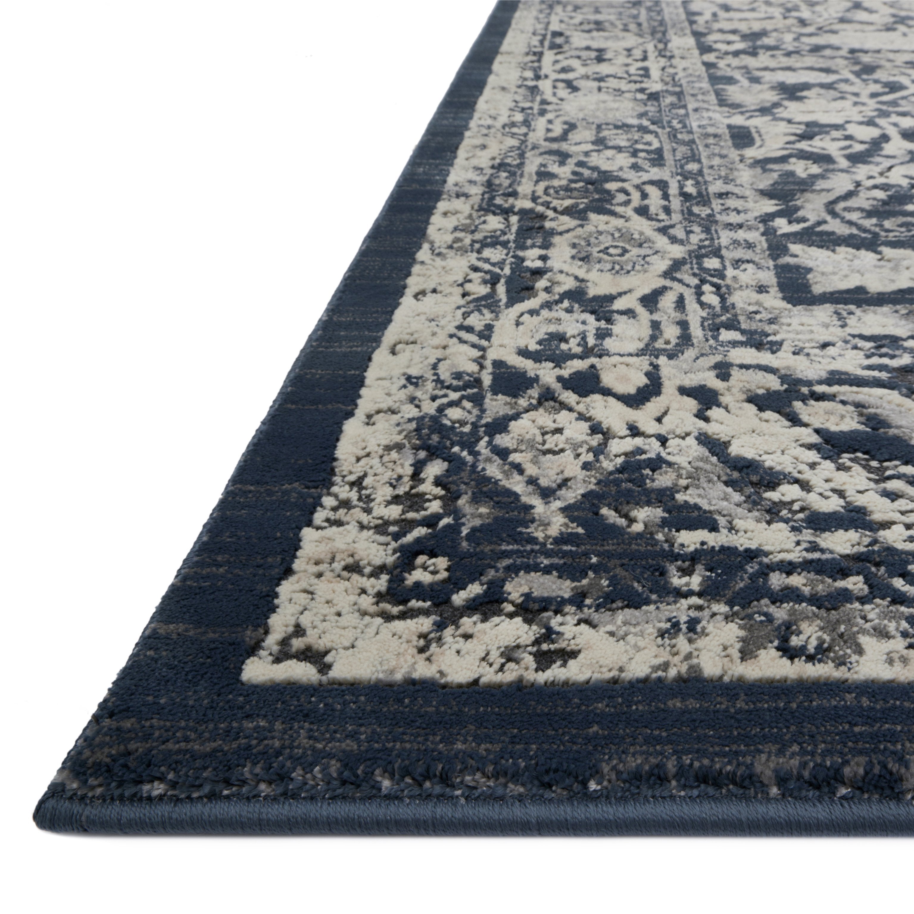 dark indigo traditional rug with white floral detail