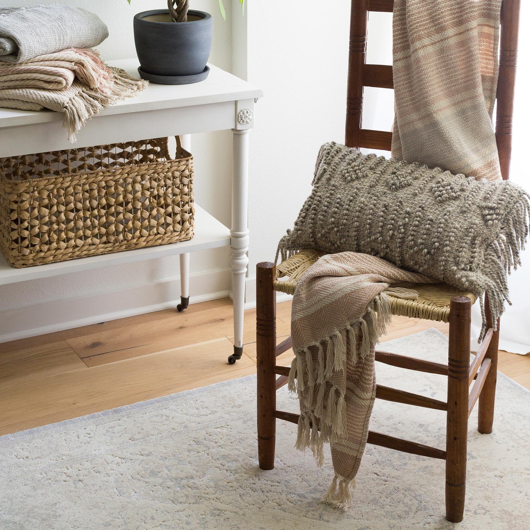 pale cream and grey distressed rug with faint floral detail