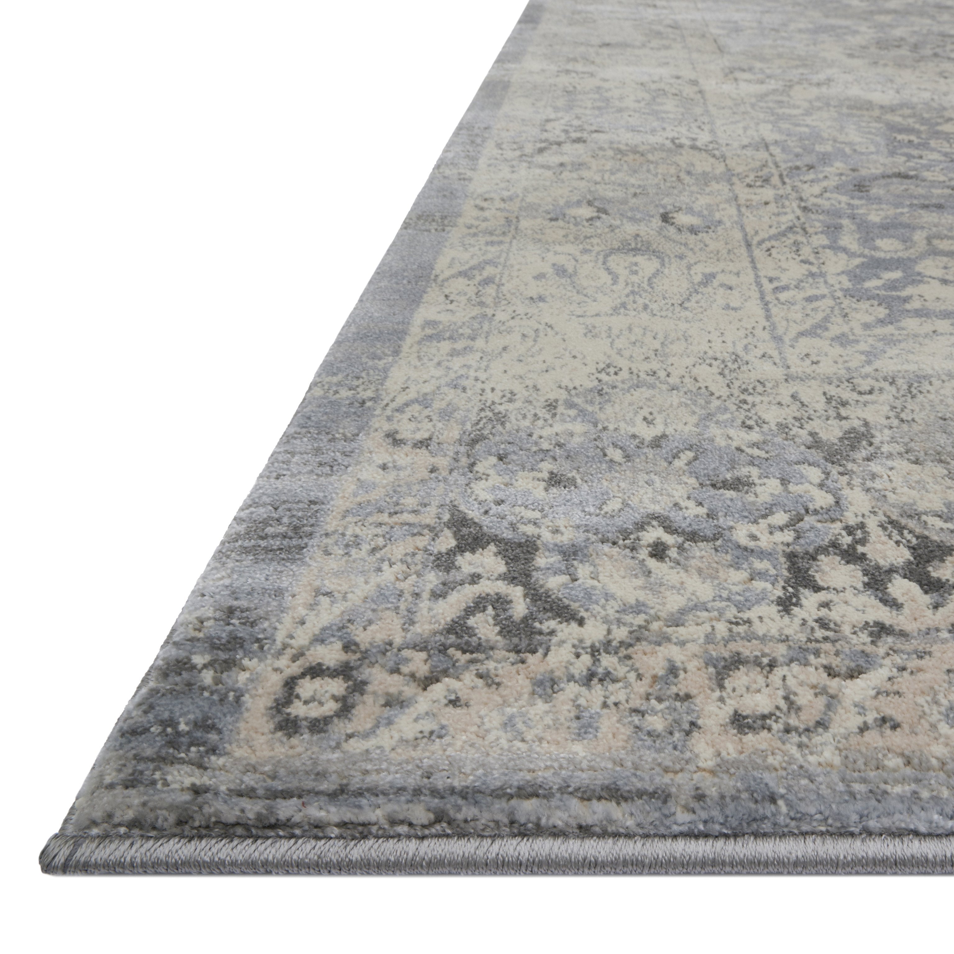 medium blue-grey distressed rug with floral pattern