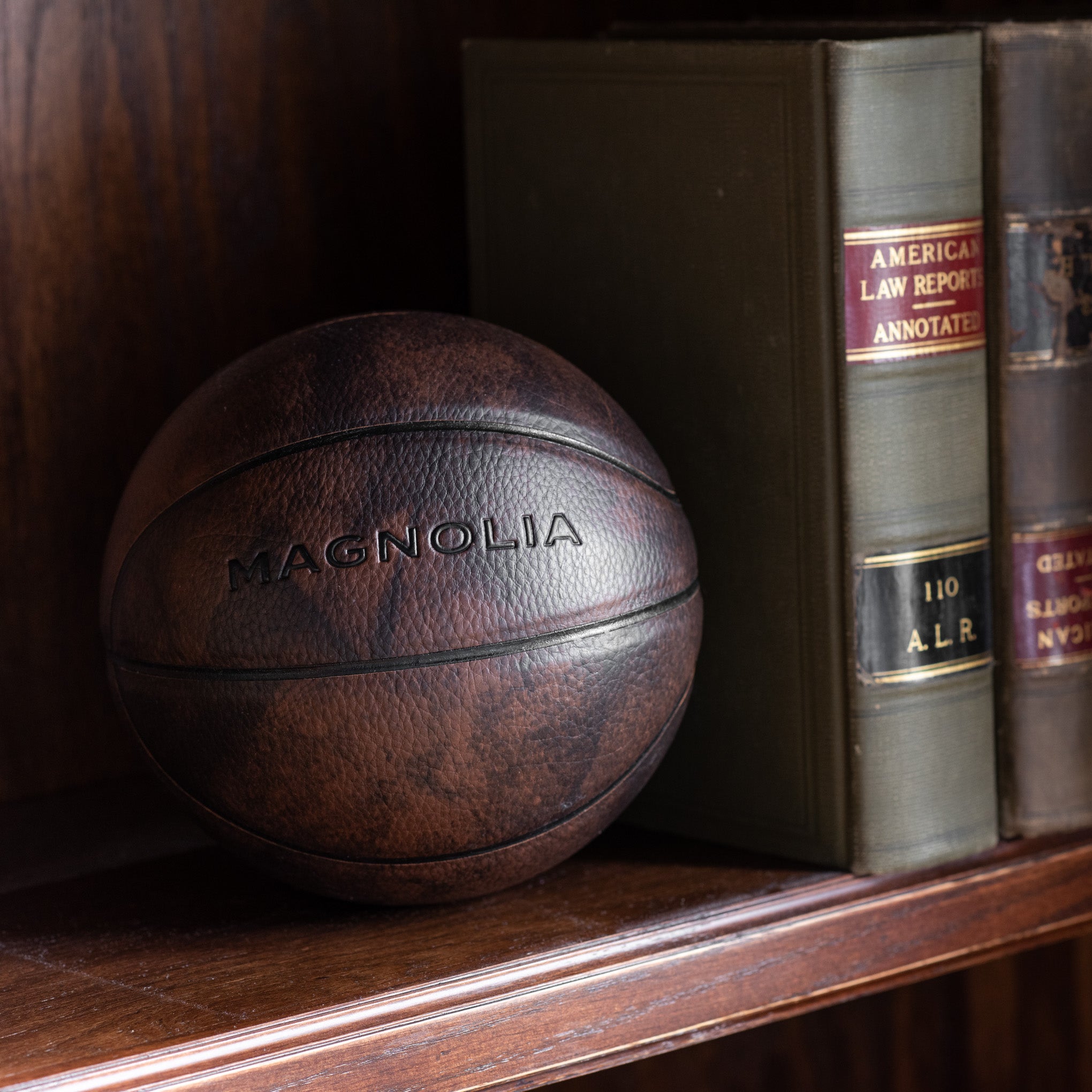 mini leather basketball with Magnoliass logo embossed