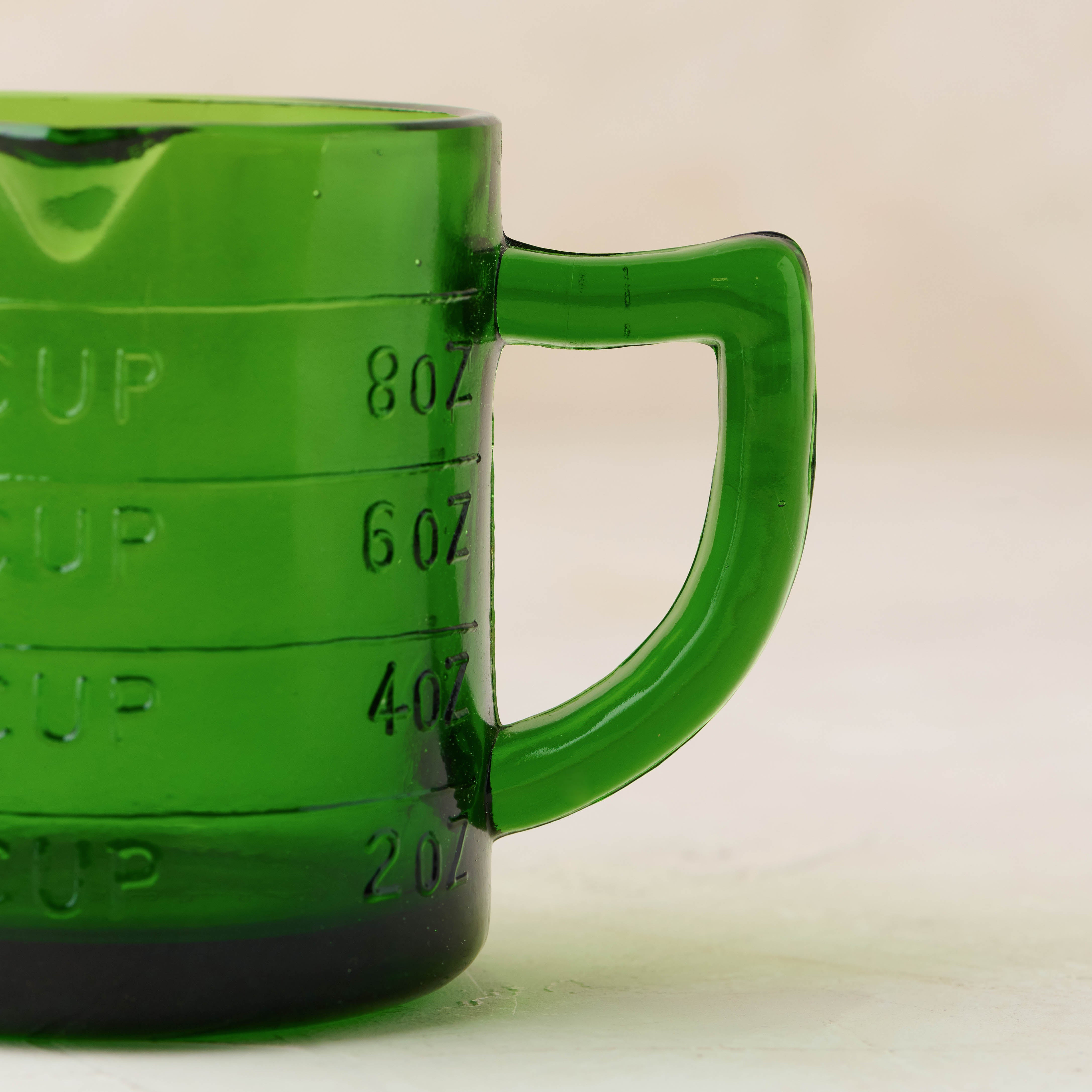 Magnoliass green glass one cup measuring cup