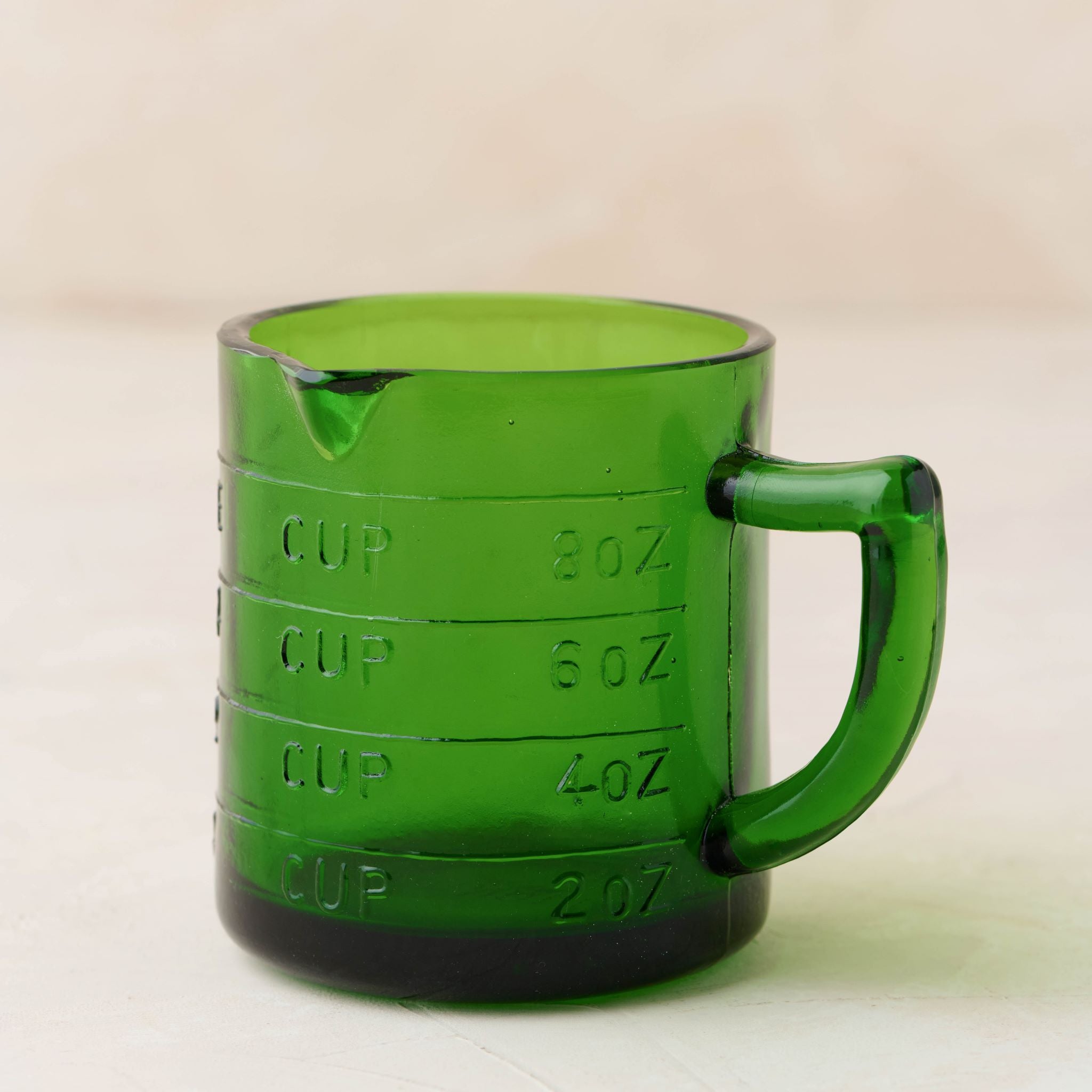 Magnoliass green glass one cup measuring cup