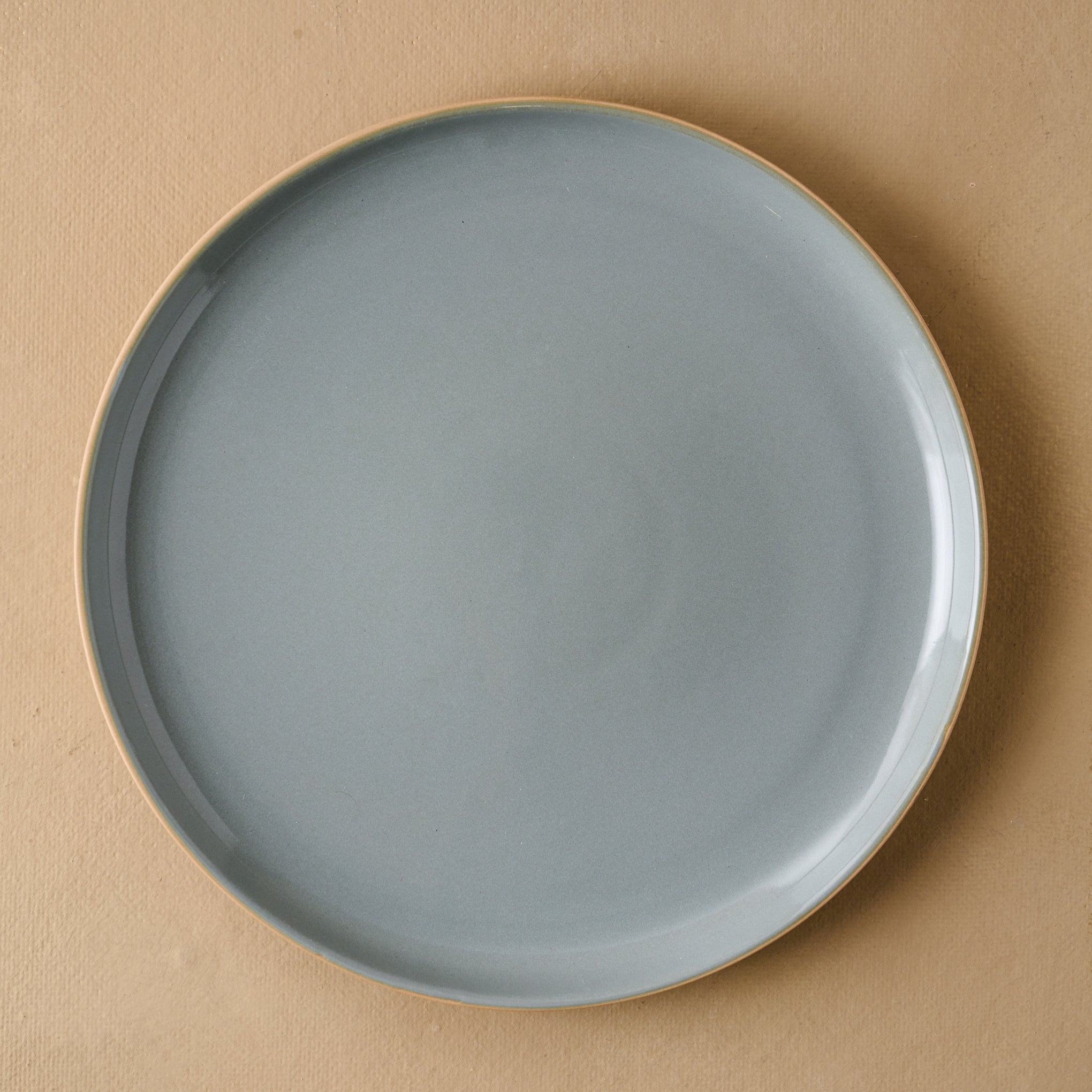 Lakelynn plate with a glazed blue gray interior and a tan exterior in dinner plate size