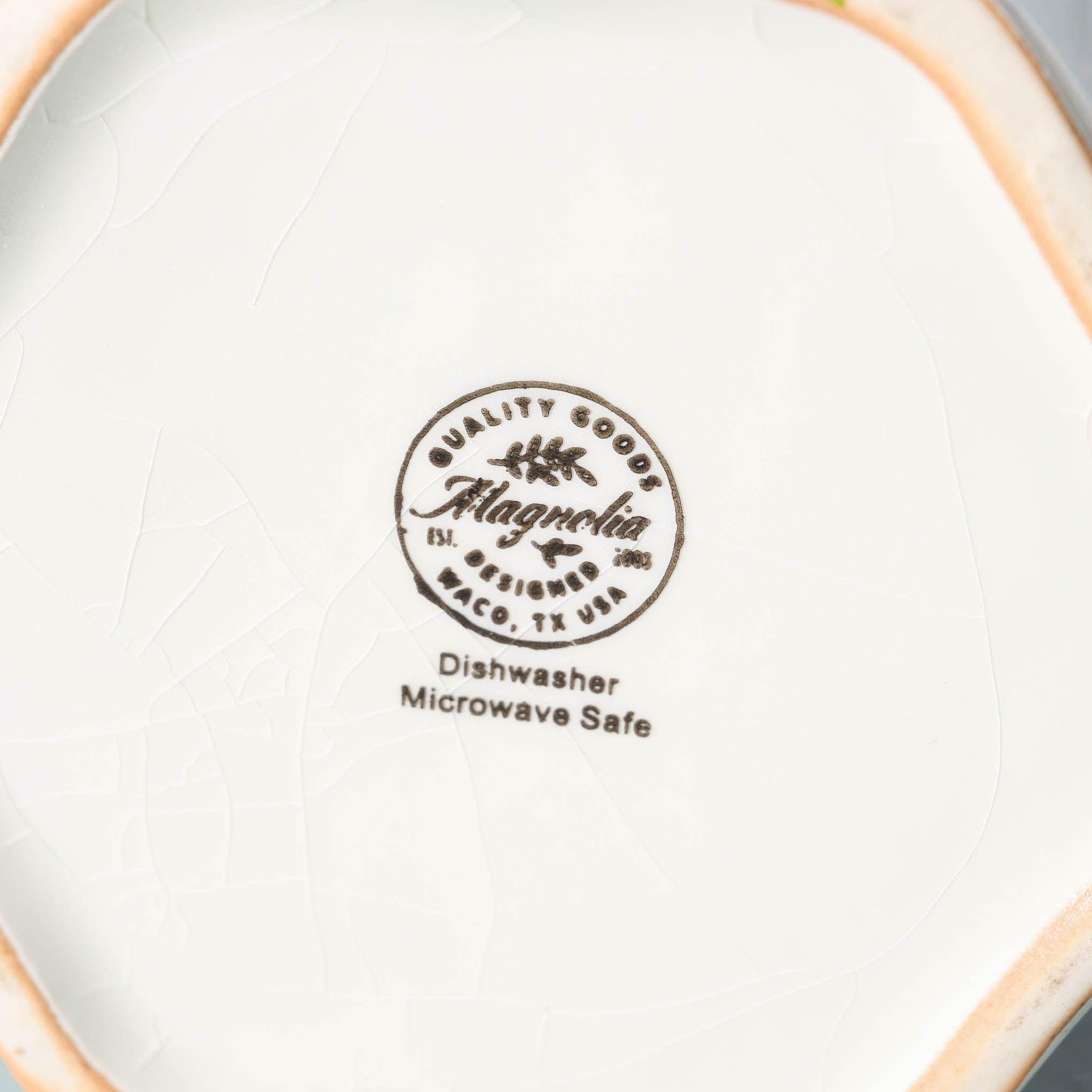 Magnoliass script logo on bottom of Vintage-Inspired Crackle Pitcher