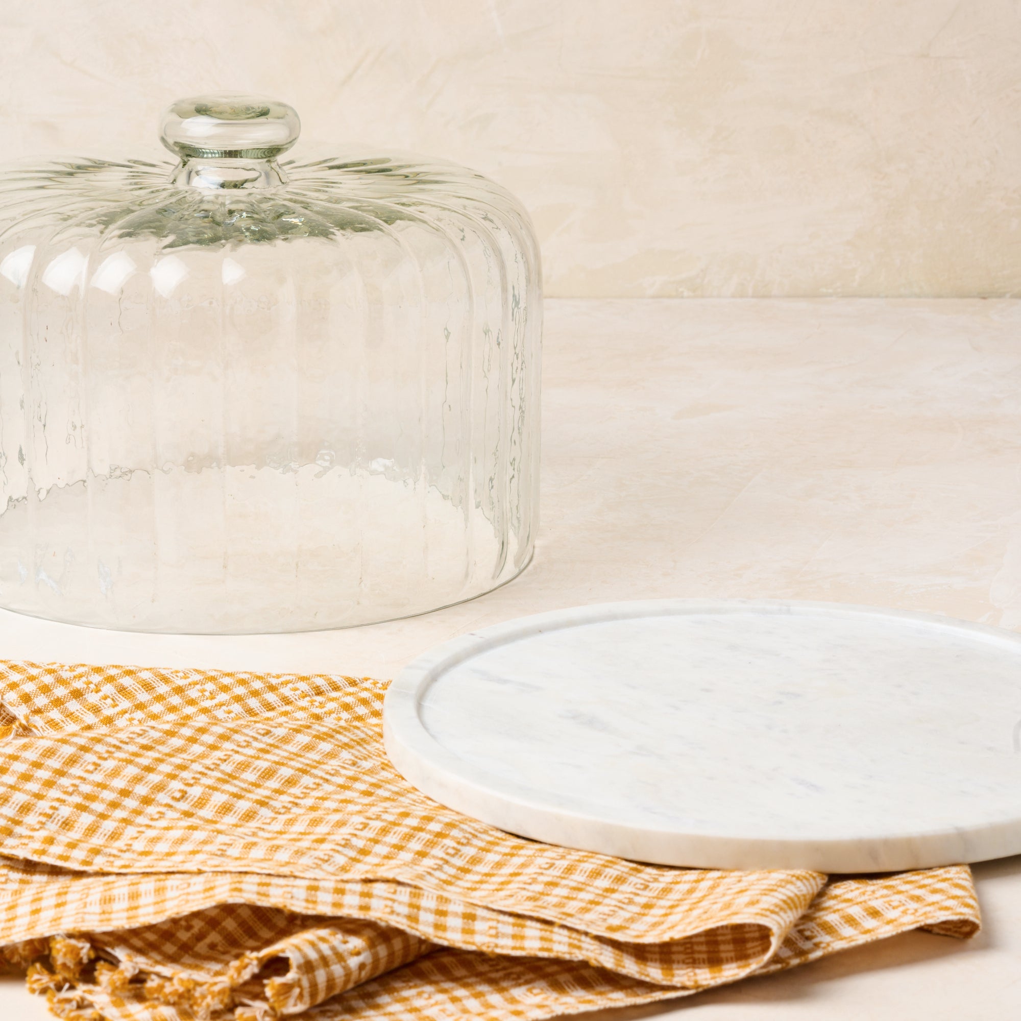 Magnoliass white marble fluted cake dome