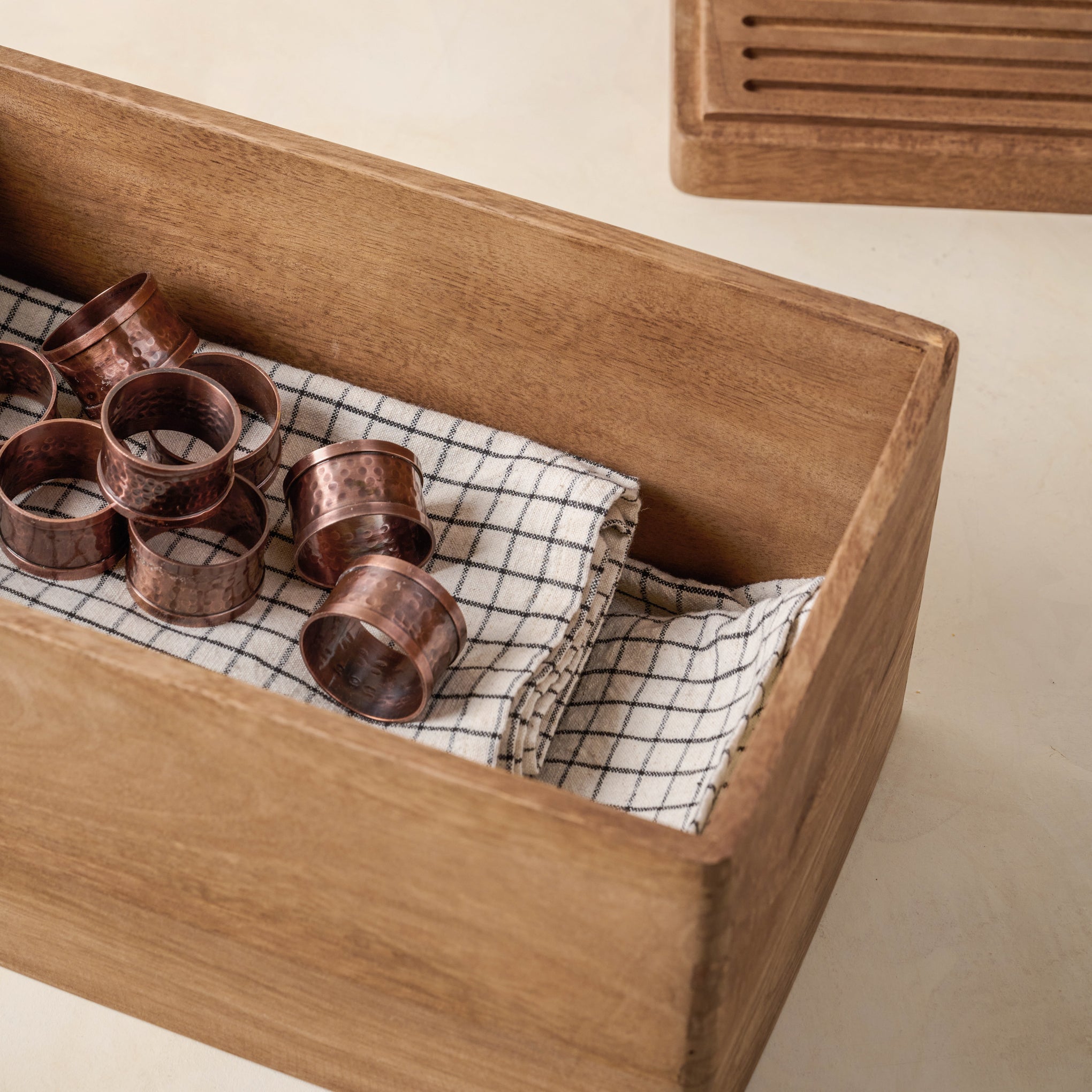Magnoliass Antiqued Wood Storage Box containing napkins