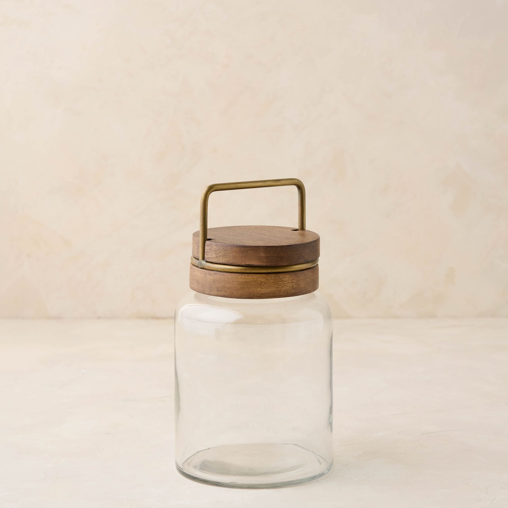Magnoliass glass canister with wood and antique brass lid