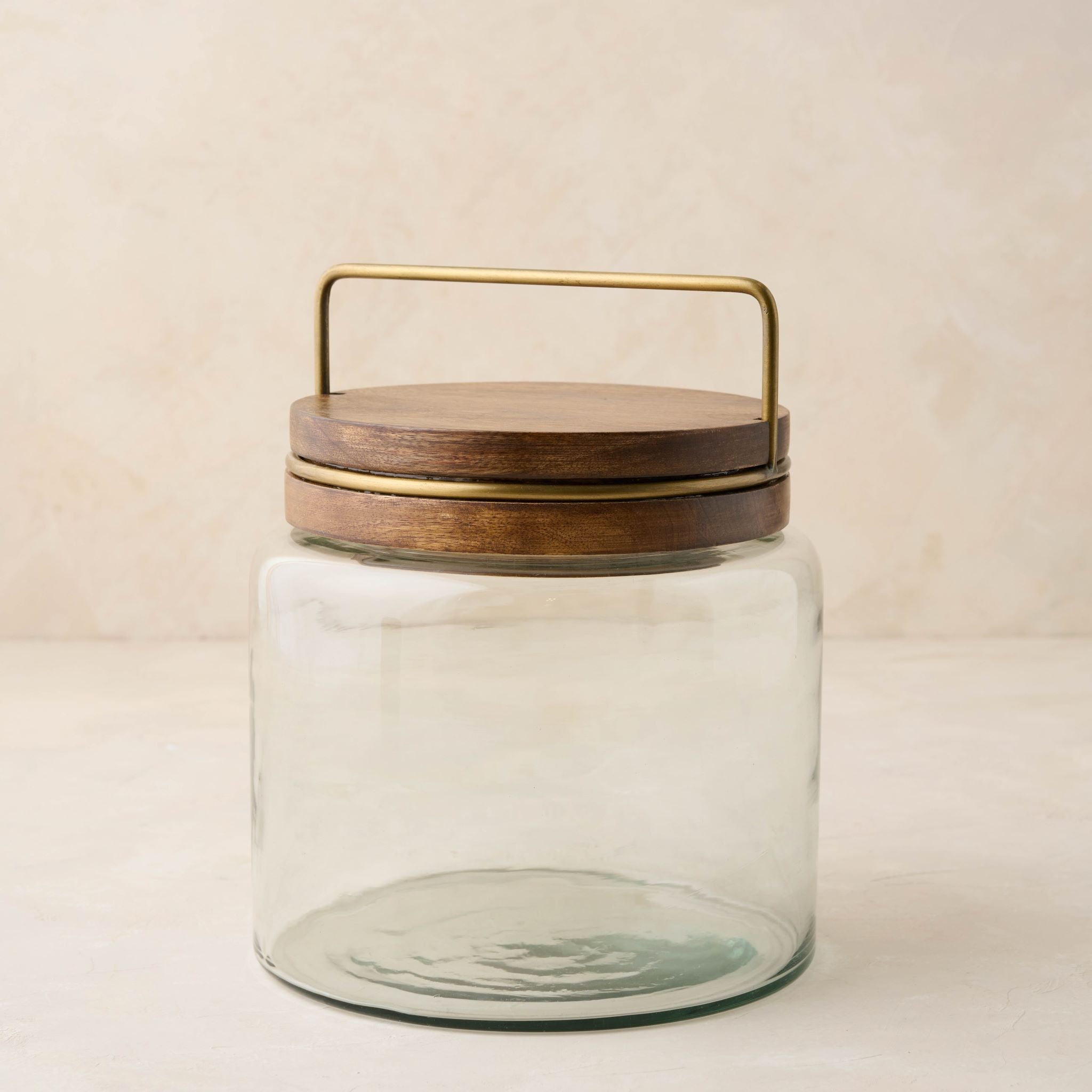 Magnoliass glass canister with wood and antique brass lid