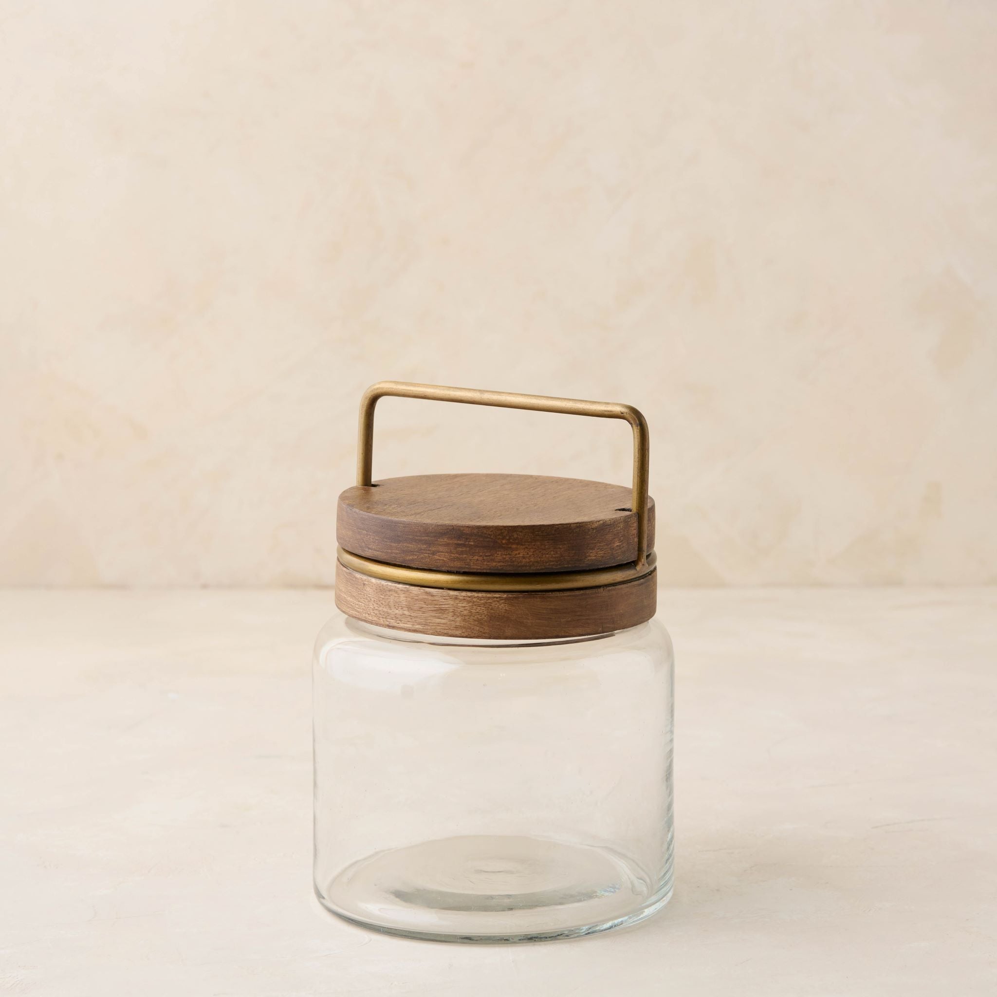 Magnoliass glass canister with wood and antique brass lid