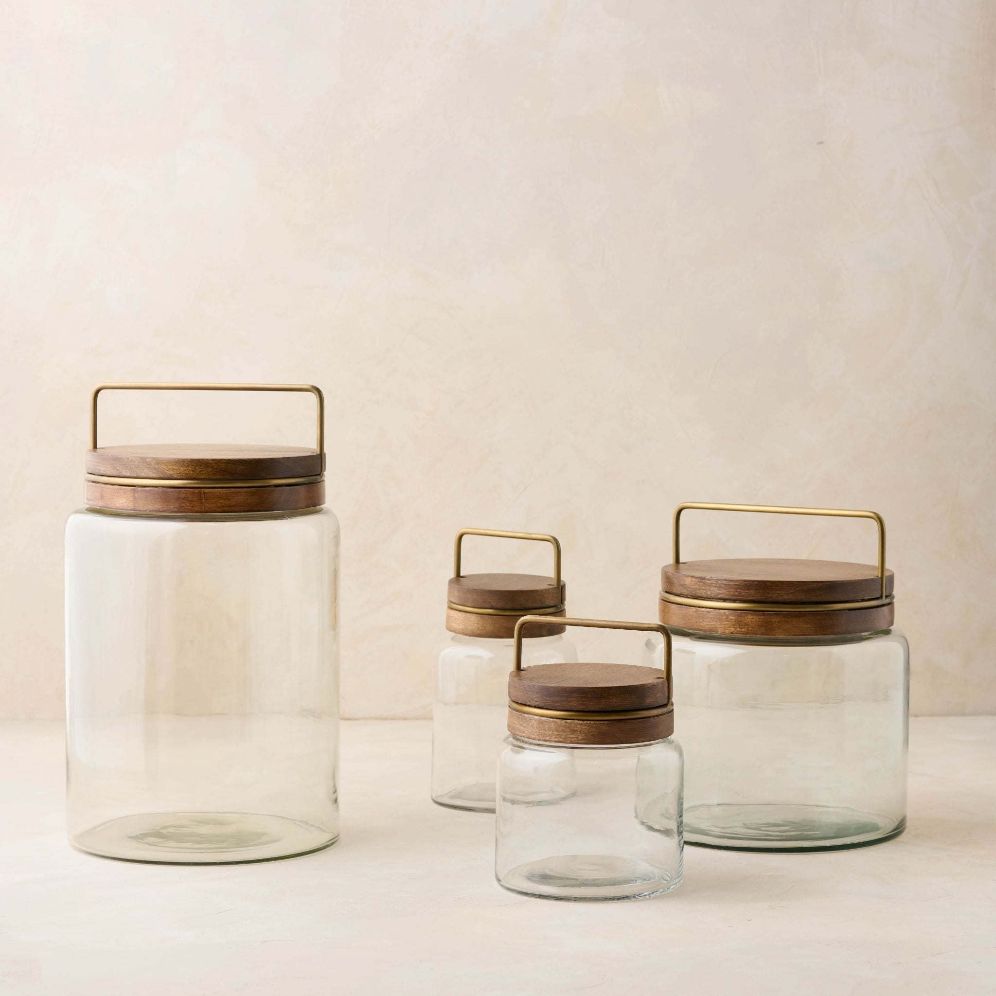 Magnoliass glass canister with wood and antique brass lid