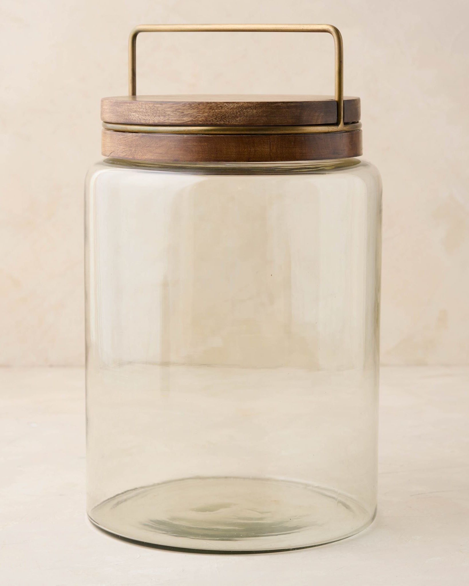 Magnoliass glass canister with wood and antique brass lid