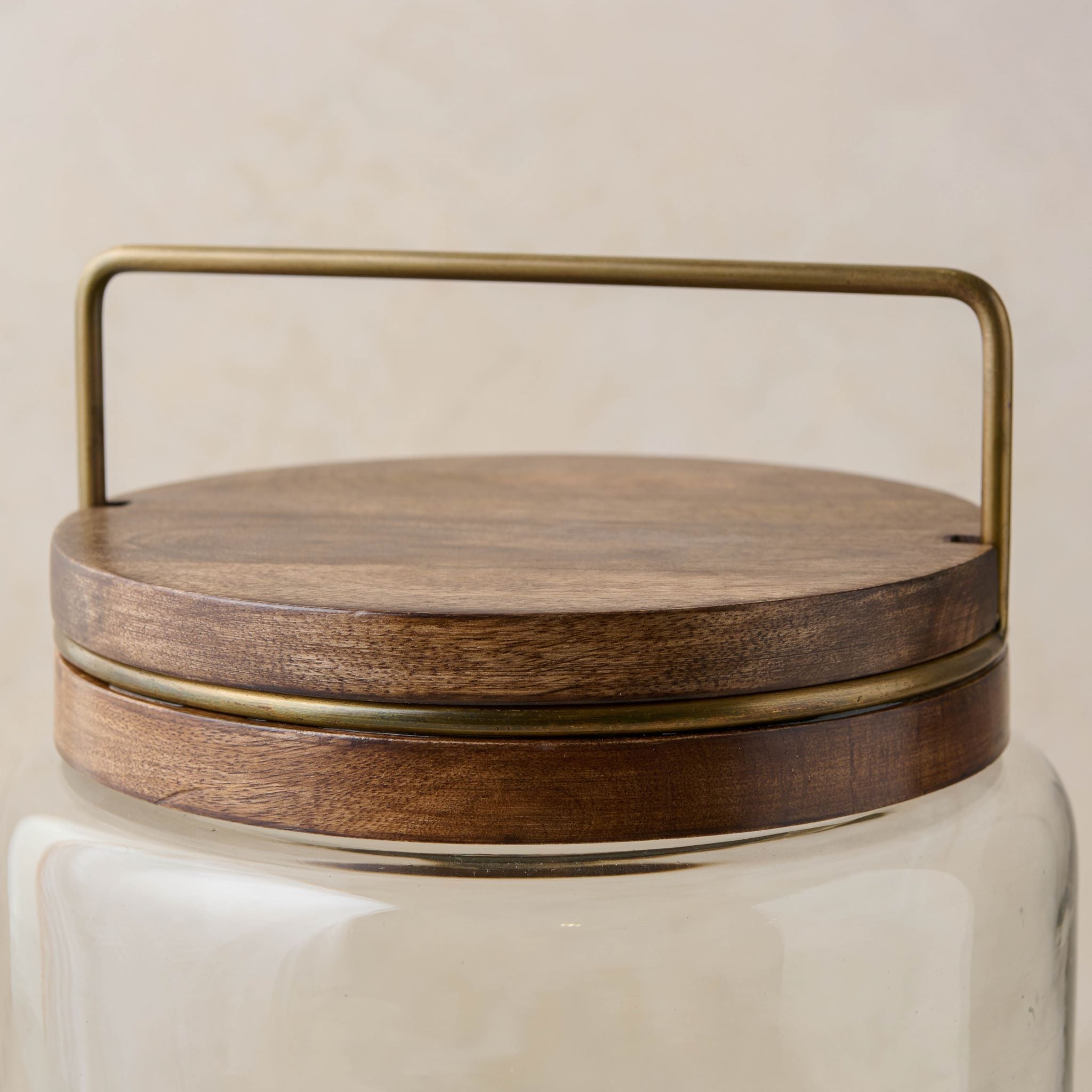 Magnoliass glass canister with wood and antique brass lid