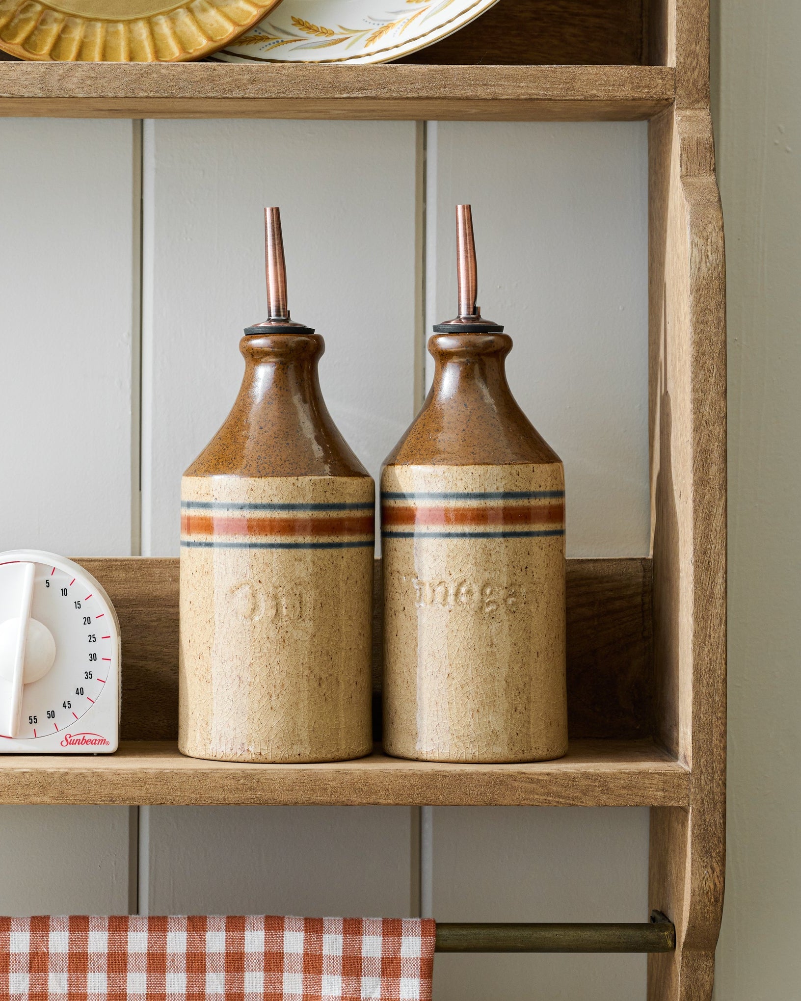 Hannon Wood and Brass Display Shelf with oil and vinegar bottles on shelf