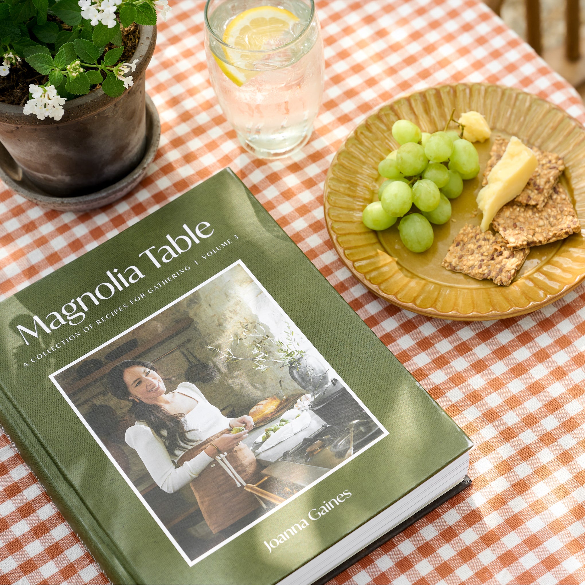 Magnoliass Table Cookbook Volume 3 on a picnic table