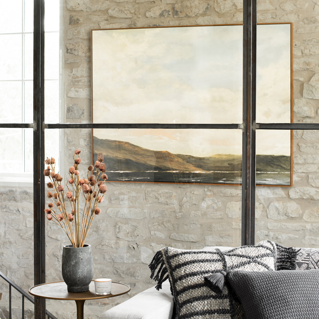 The Hills at Dusk on a wall seen through a window pane