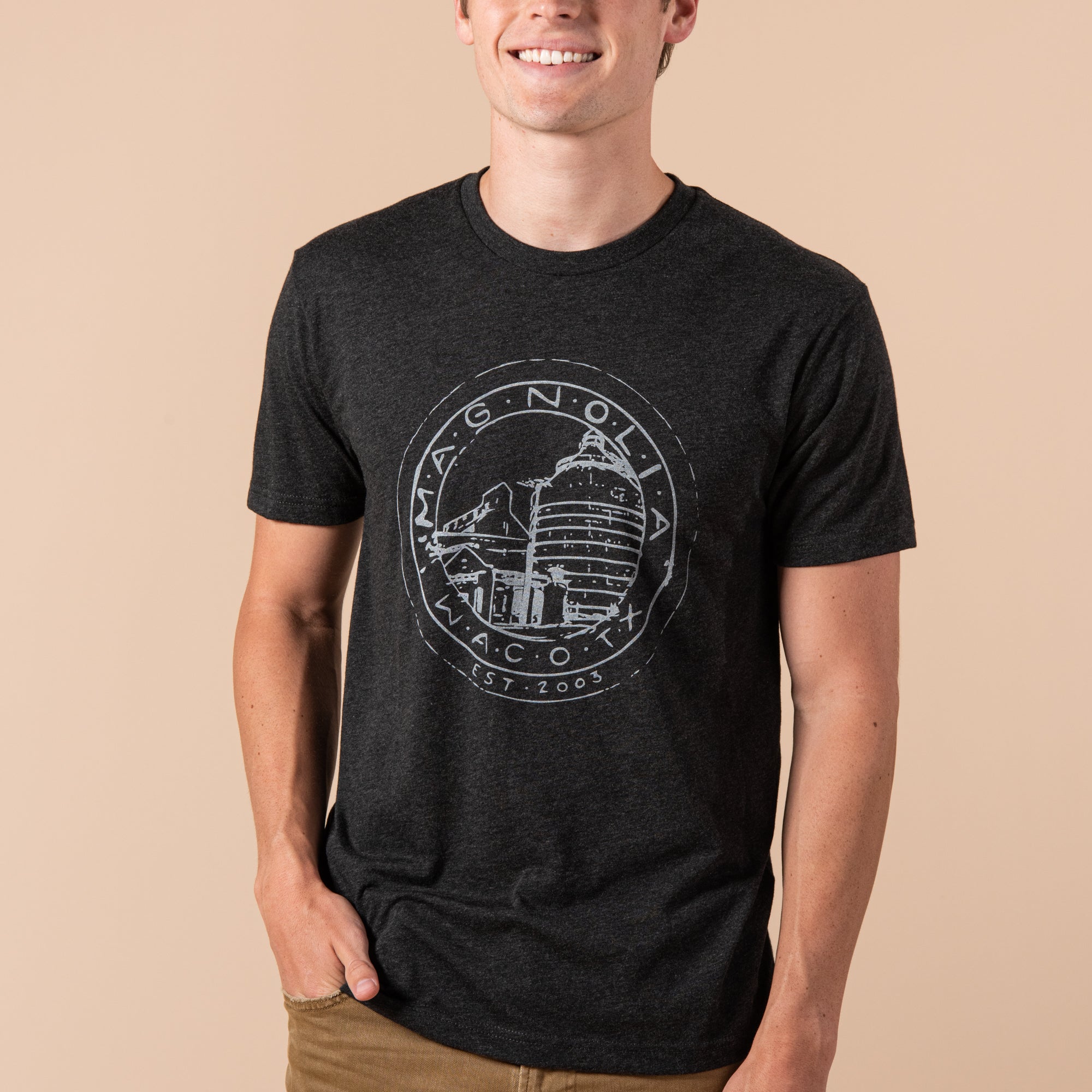 black heathered t-shirt with white Magnoliass silos seal logo