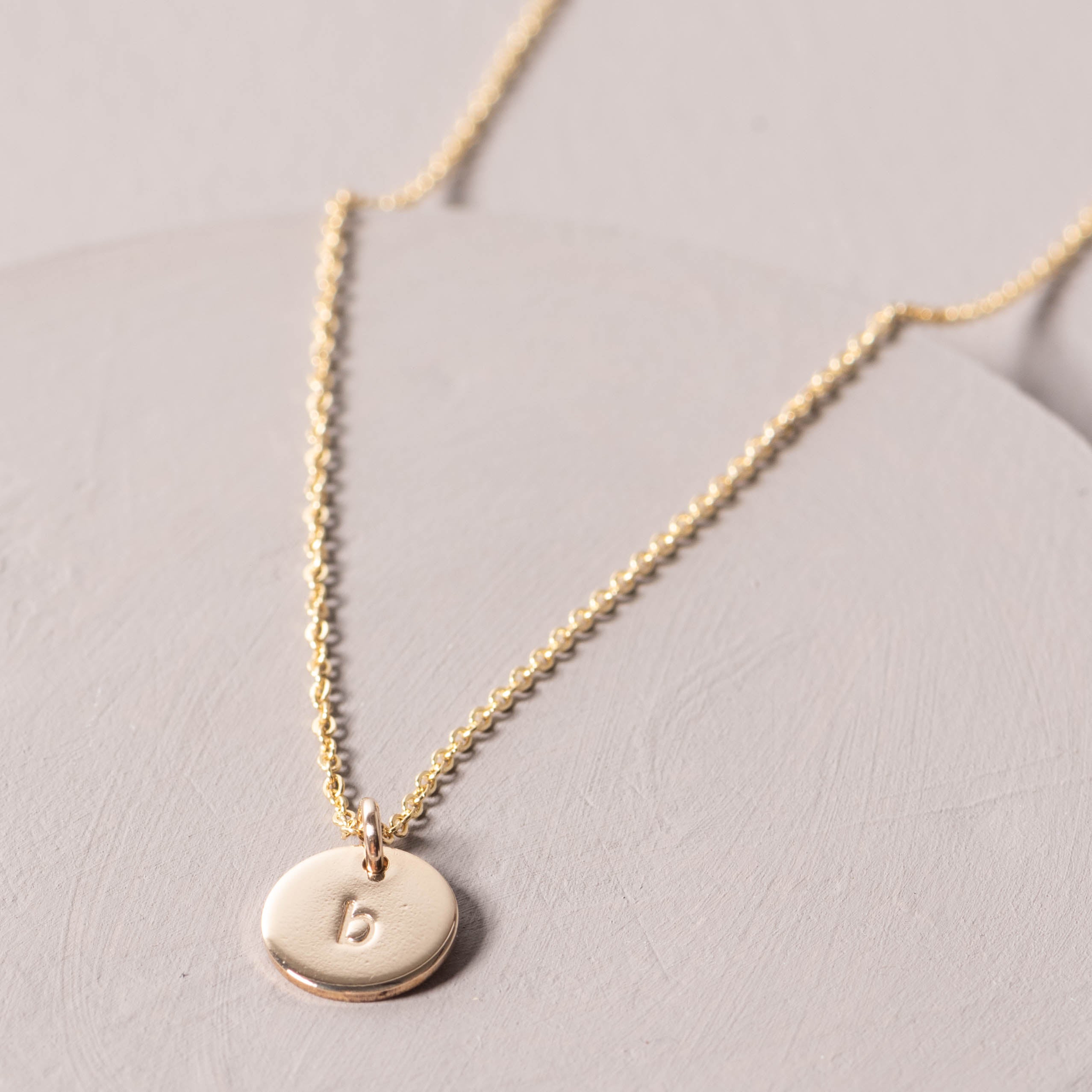 Magnoliass gold initial disc necklace