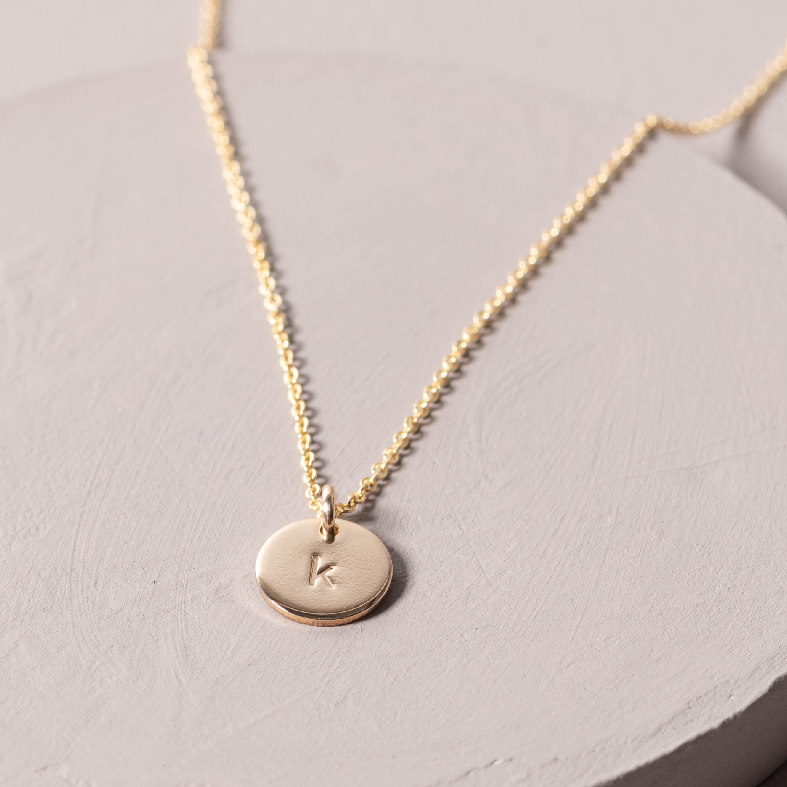 Magnoliass gold initial disc necklace