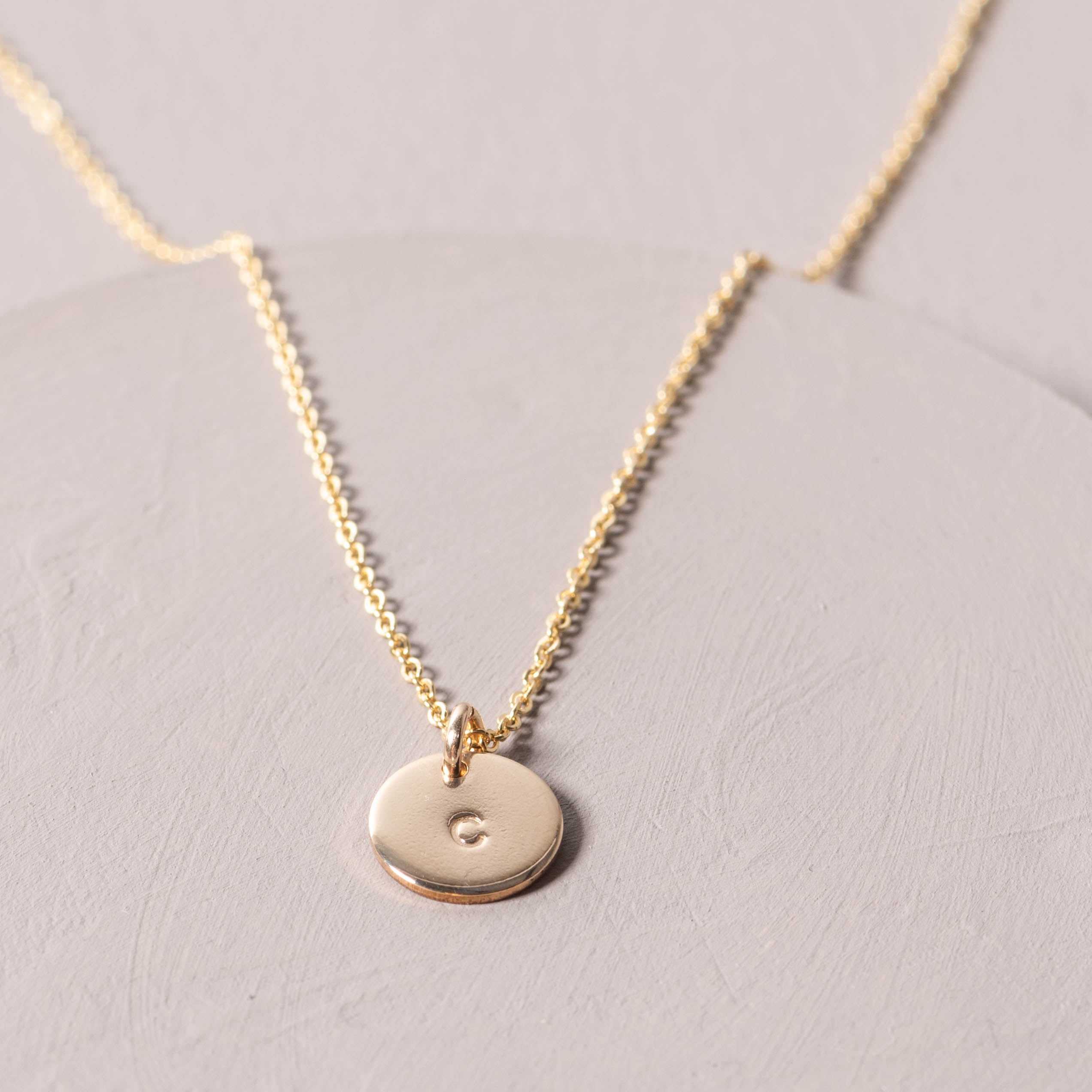 Magnoliass gold initial disc necklace