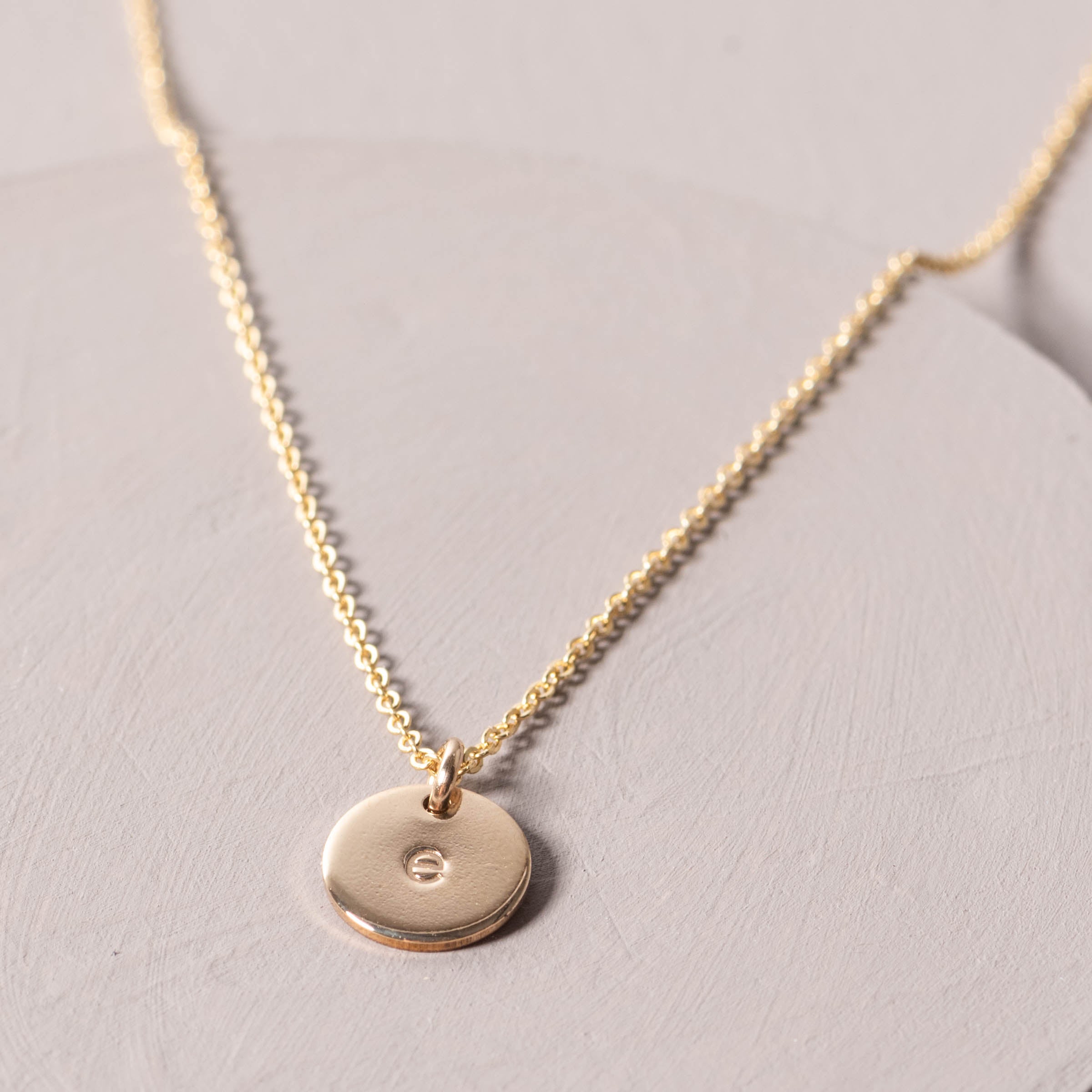 Magnoliass gold initial disc necklace