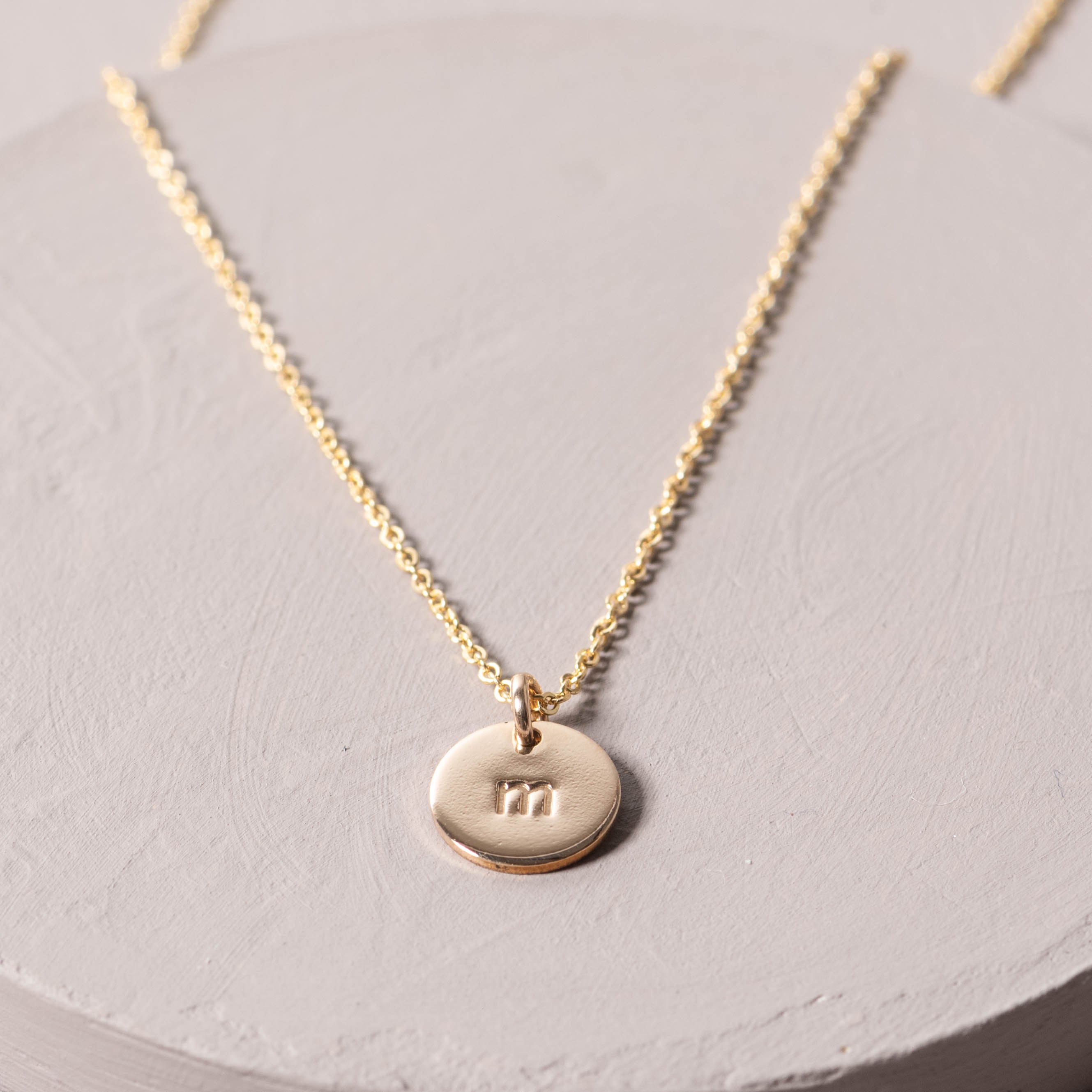 Magnoliass gold initial disc necklace