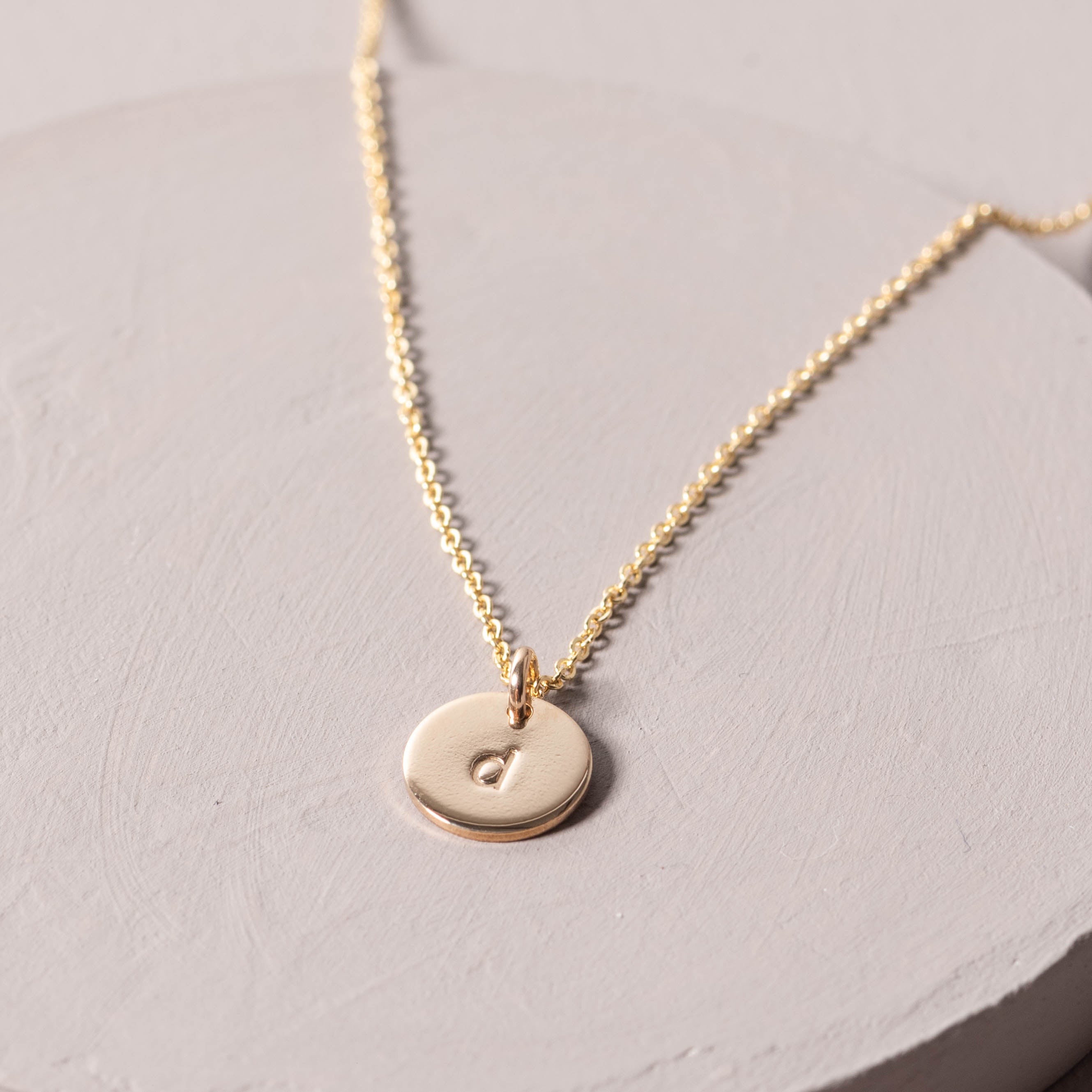 Magnoliass gold initial disc necklace