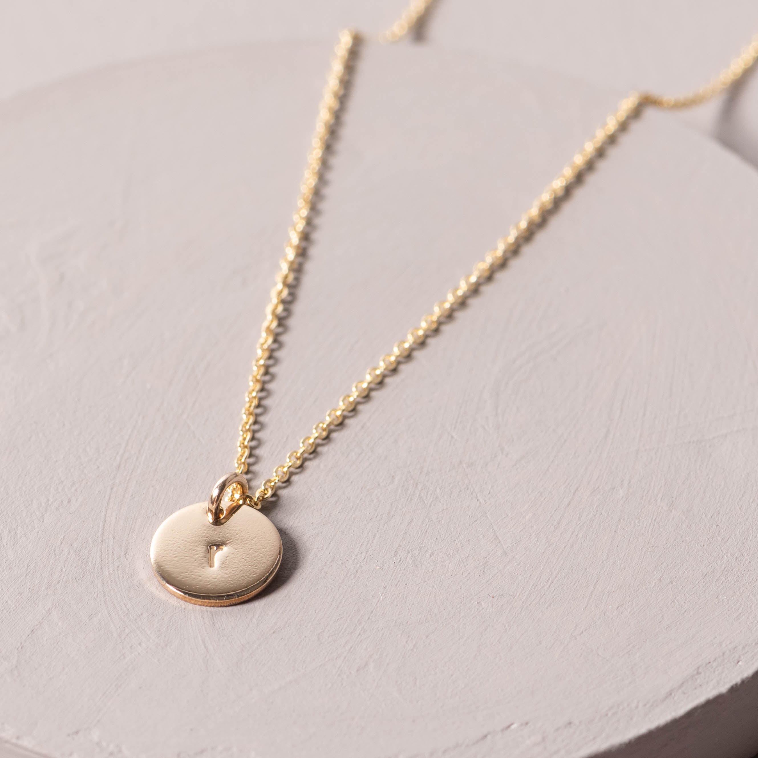 Magnoliass gold initial disc necklace