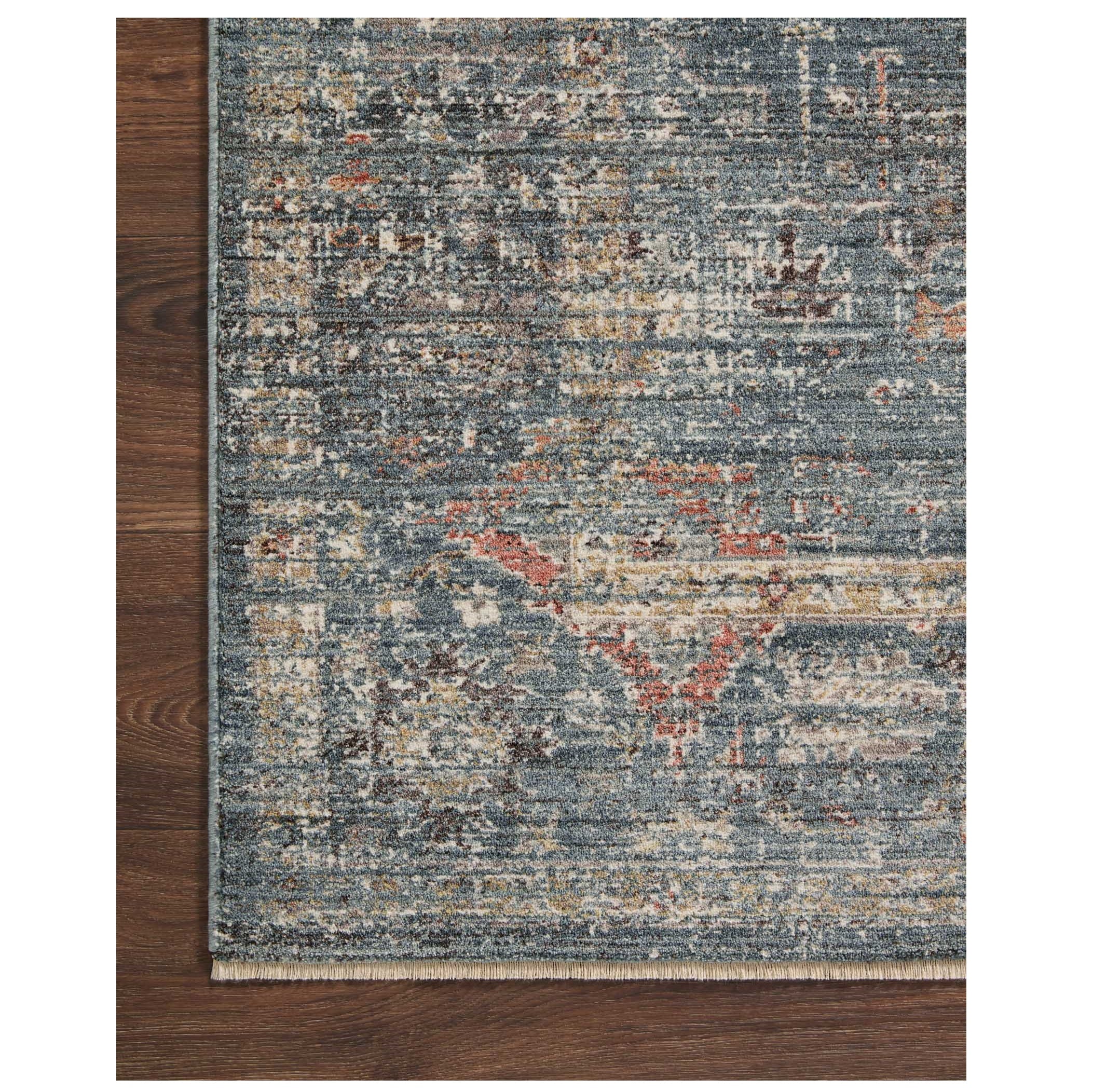 Millie Denim Multi Rug corner on wood floor