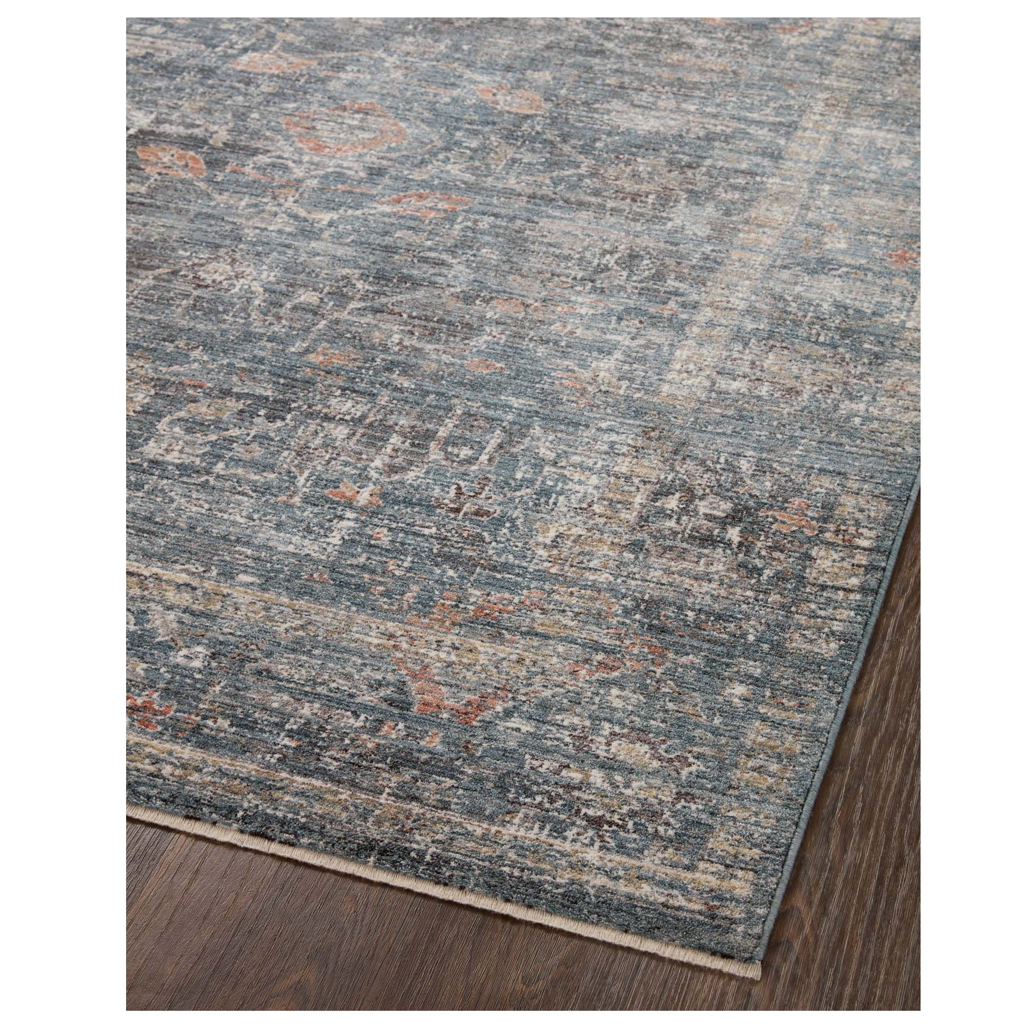 Millie Denim Multi Rug corner on wood floor