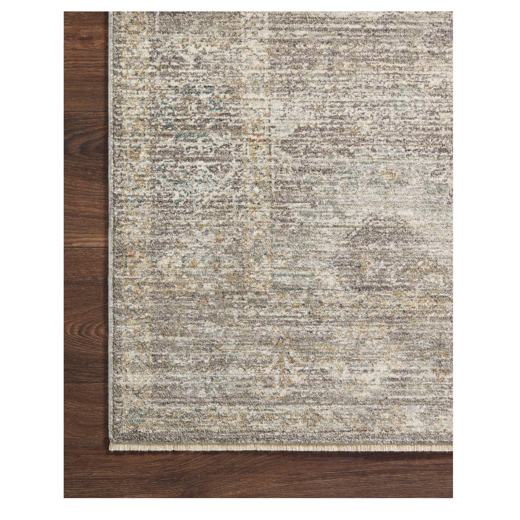 Millie Stone Natural Rug corner on wood floor