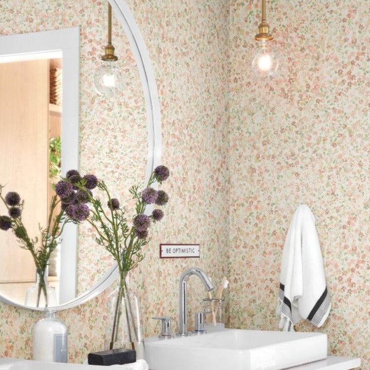 light pink floral pattern on white wallpaper