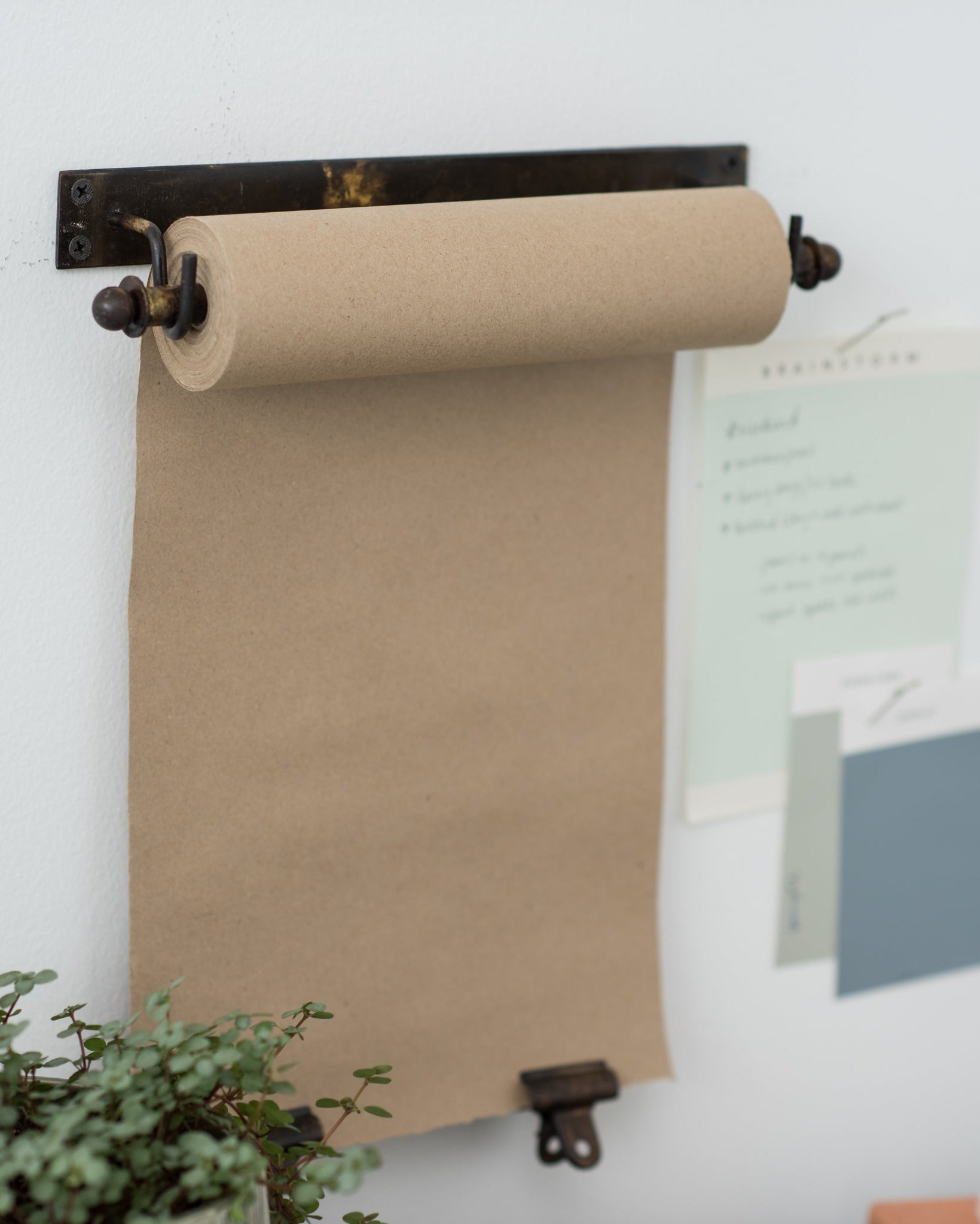 hanging black metal bracket and paper scroll