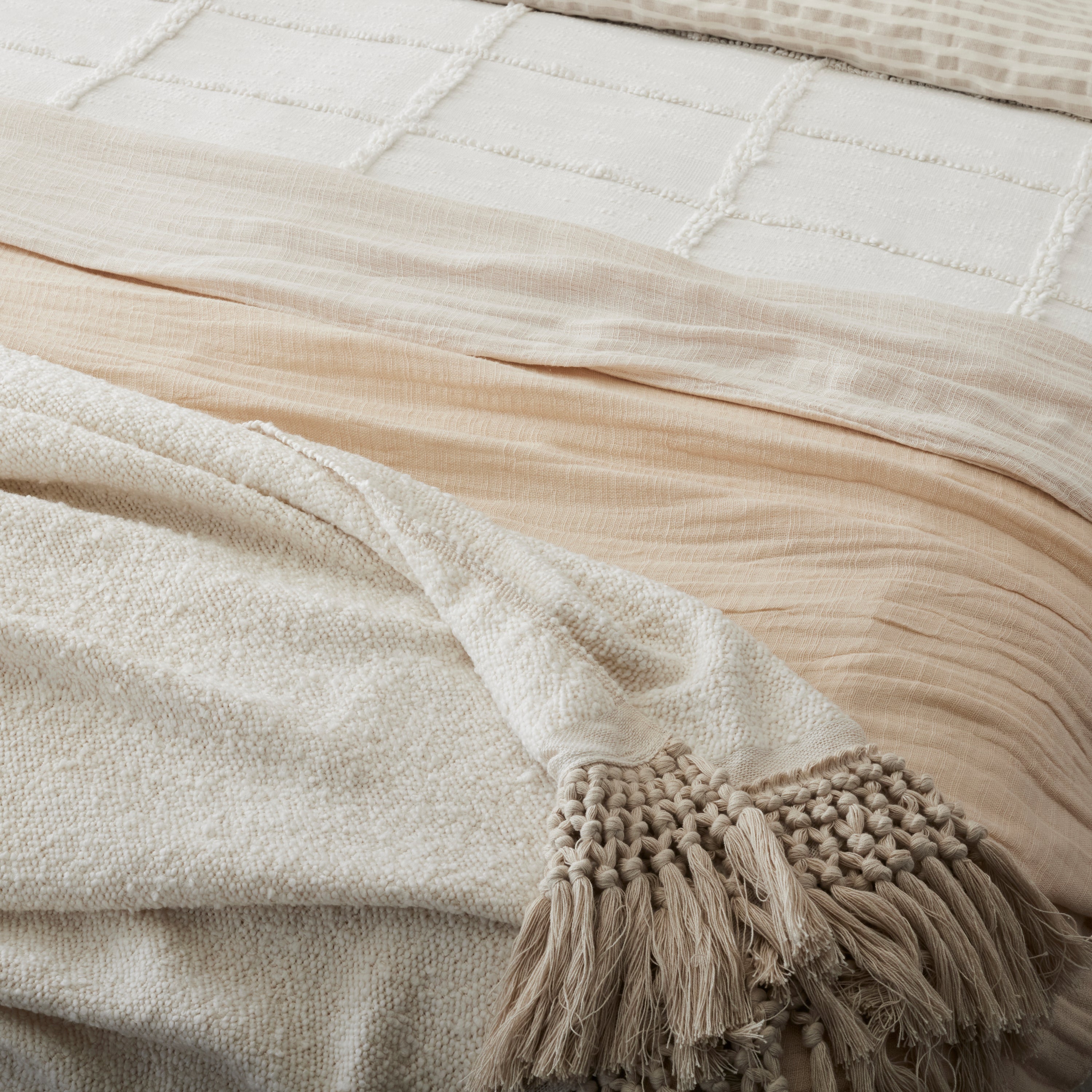 Angora Tassel Throw on the foot of a bed