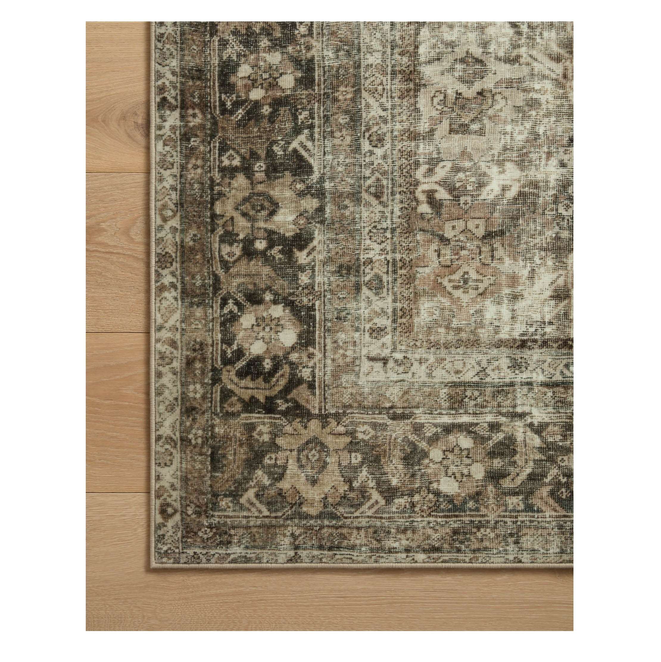 Sinclair Pebble Taupe Rug corner on wood floor